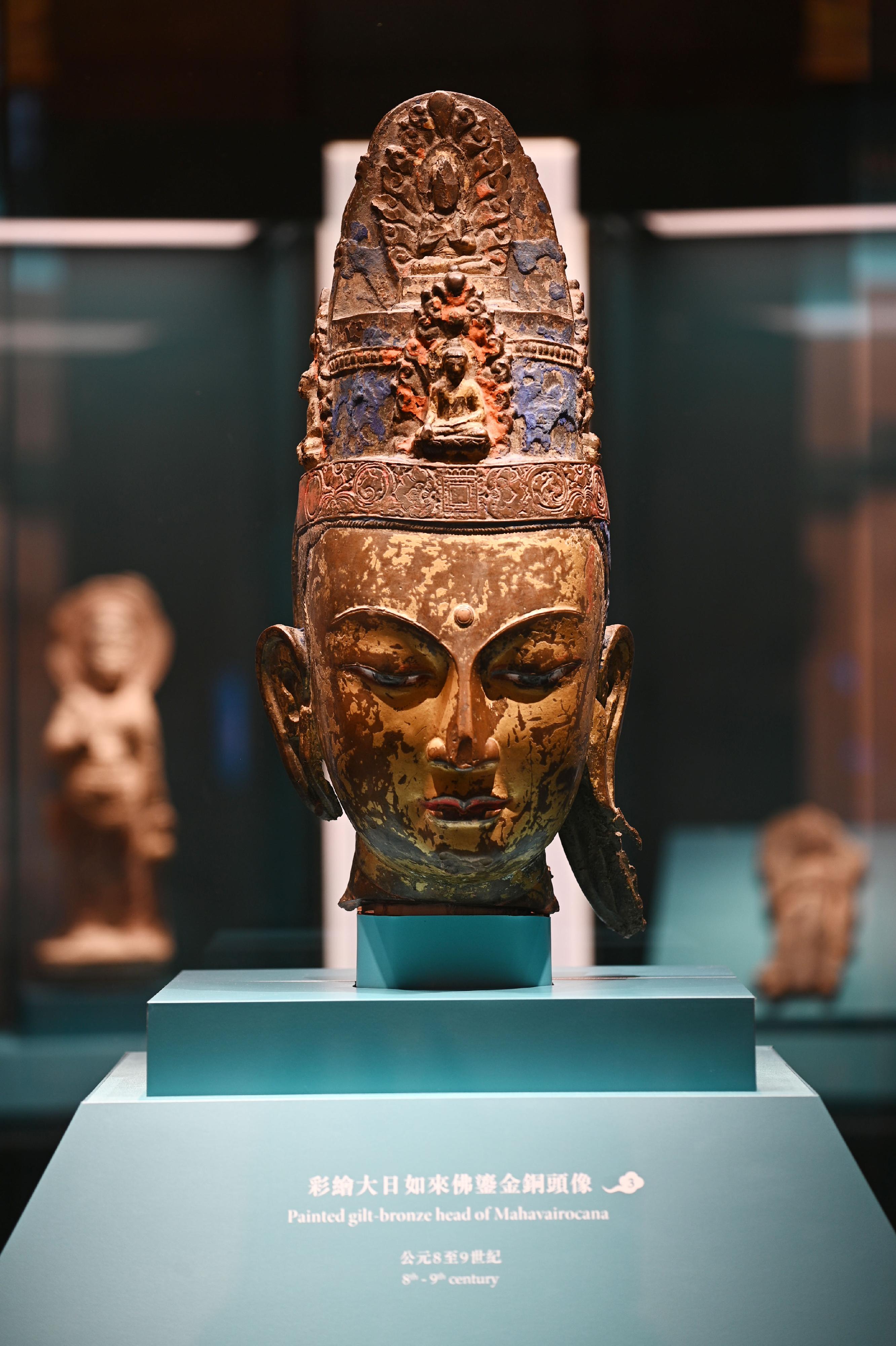 The opening ceremony for the exhibition "The Hong Kong Jockey Club Series: Dunhuang: Enchanting Tales for Millennium" was held today (August 23) at the Hong Kong Heritage Museum. Picture shows a painted gilt-bronze head of Mahavairocana.

