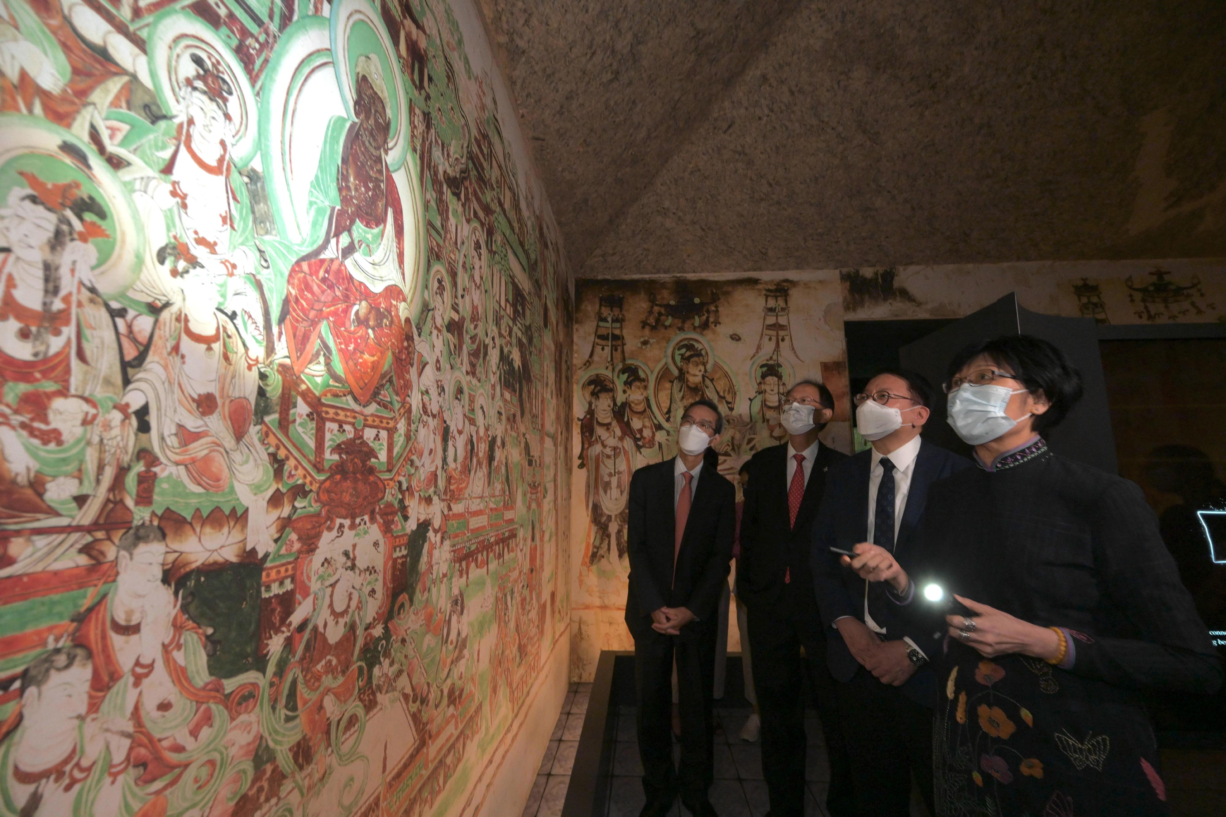 The opening ceremony for the exhibition "The Hong Kong Jockey Club Series: Dunhuang: Enchanting Tales for Millennium" was held today (August 23) at the Hong Kong Heritage Museum. Photo shows the Chief Secretary for Administration, Mr Chan Kwok-ki (second right) touring the exhibition.