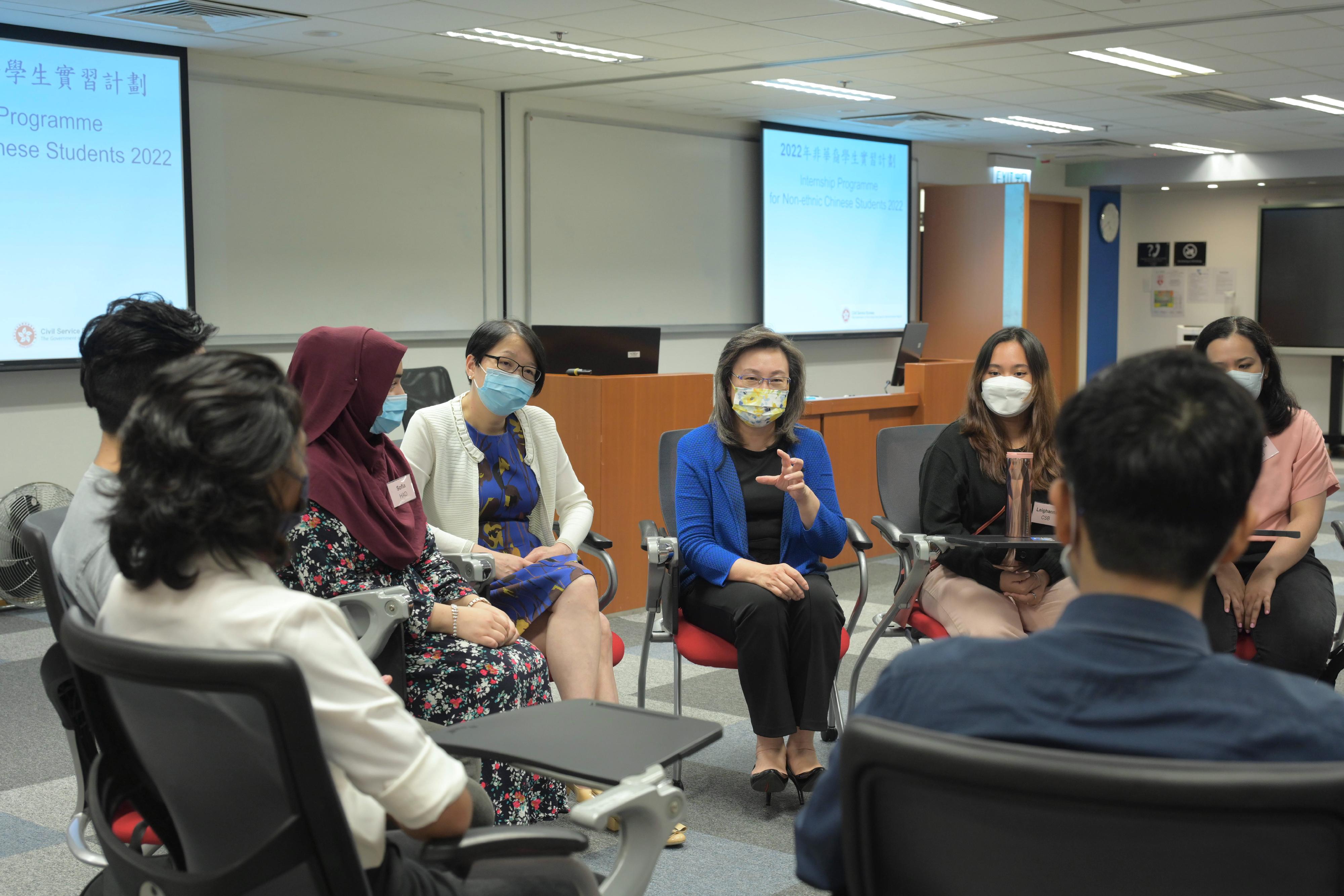 The Secretary for the Civil Service, Mrs Ingrid Yeung, today (August 24) met with non-ethnic Chinese students participating in a government internship programme. Photo shows Mrs Yeung (third right) chatting with the interns to learn about their internship experience and takeaways.