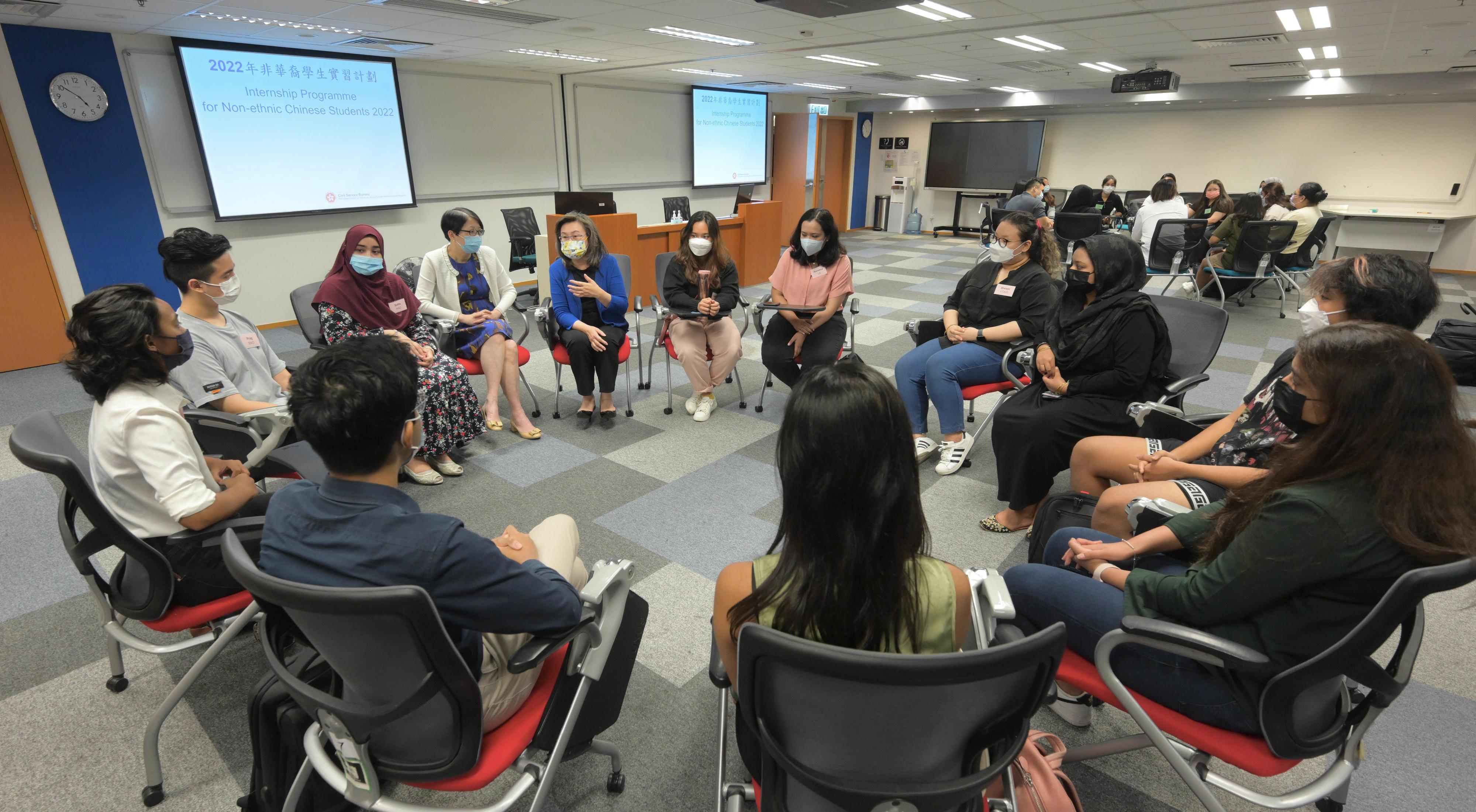 The Secretary for the Civil Service, Mrs Ingrid Yeung, today (August 24) met with non-ethnic Chinese students participating in a government internship programme. Photo shows Mrs Yeung chatting with the interns to encourage them to get prepared for their career development in future.
