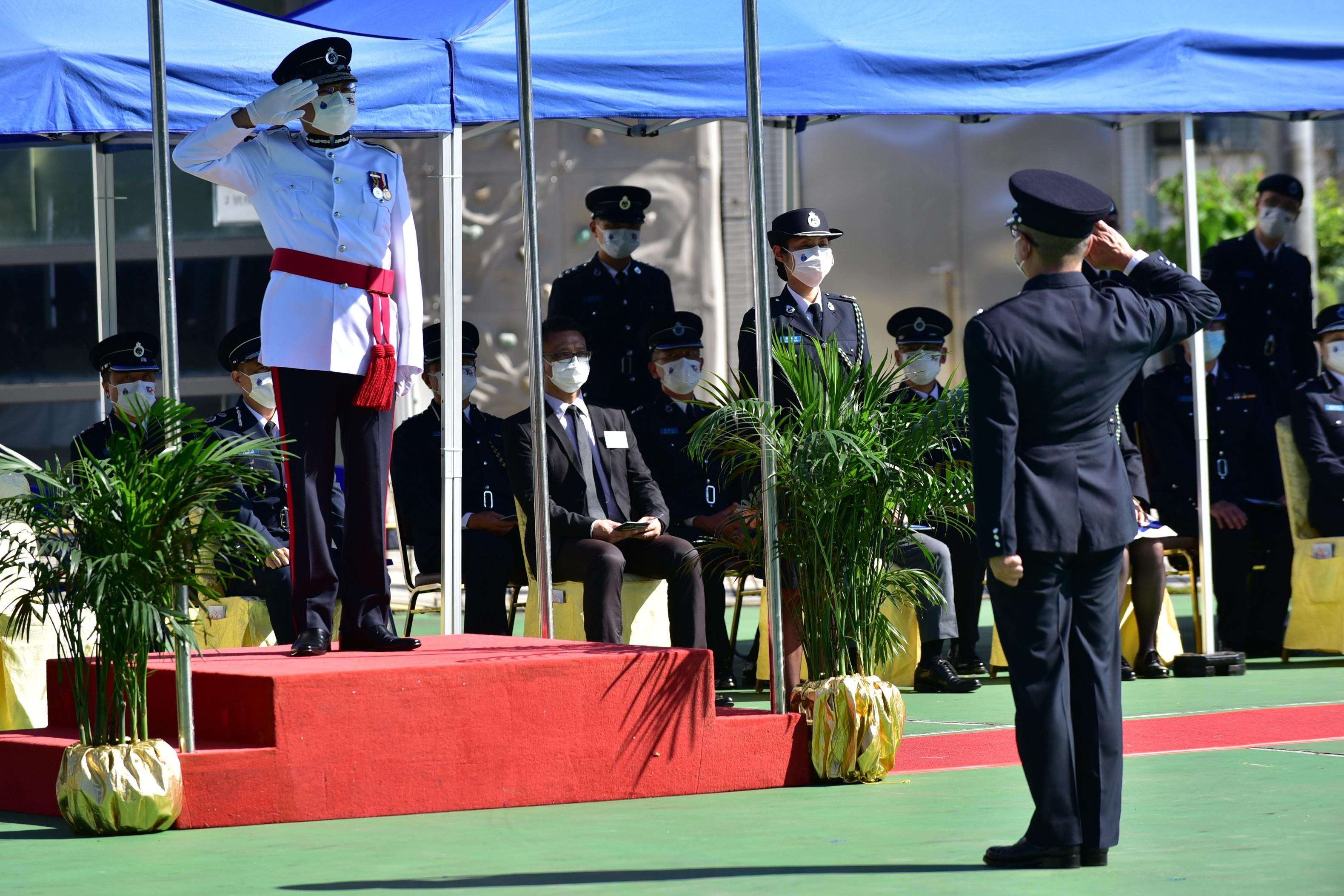 The Civil Aid Service held the 84th Recruits Passing-out Parade at its headquarters today (September 4). Photo shows the Deputy Commissioner  (Administration) of Civil Aid Service, Mr Wilfred Lam (left), taking the salute from the parade.