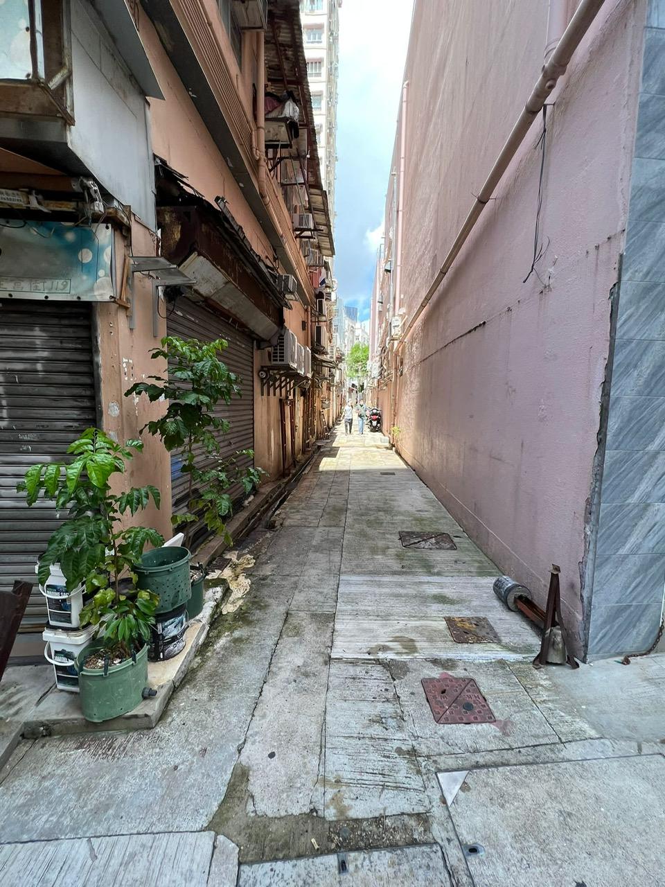 The Home Affairs Department and its District Offices conducted a series of cleaning works, publicity and educational activities during July and August to support the Government Programme on Tackling Hygiene Black Spots launched under the District Matters Co-ordination Task Force. Photo shows a back alley in Kwun Tong after the joint operation for removal of abandoned vehicles co-ordinated by the Kwun Tong District Office and relevant departments. 