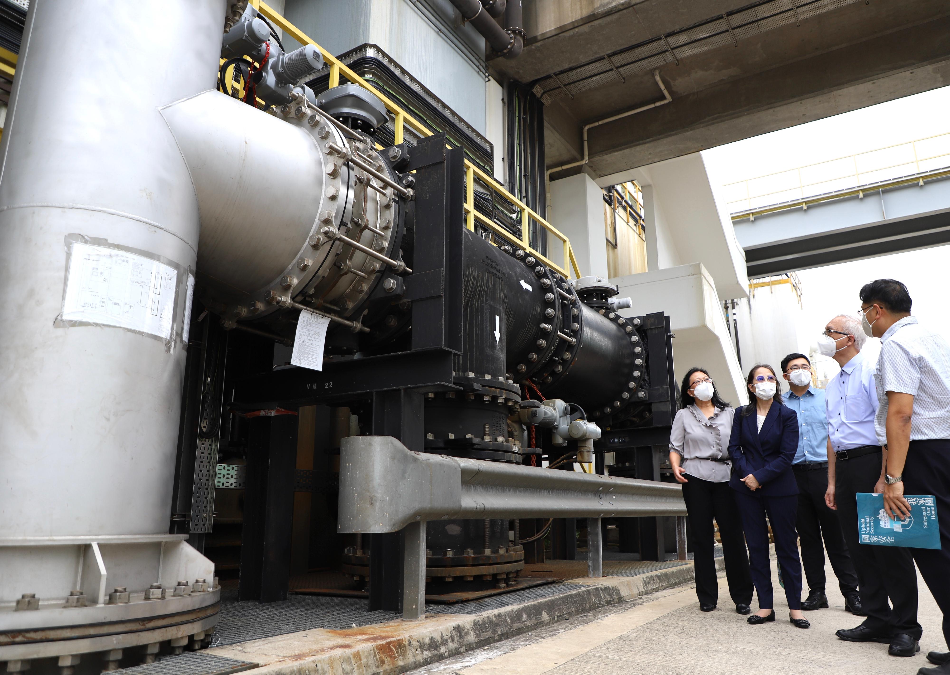 The Secretary for Environment and Ecology, Mr Tse Chin-wan, and the Under Secretary for Environment and Ecology, Miss Diane Wong, today (September 7) visited the Stonecutters Island Sewage Treatment Works of the Drainage Services Department to learn more about the work of the department. Photo shows Mr Tse (second right) and Miss Wong (second left), accompanied by the Director of Drainage Services, Ms Alice Pang (first left), inspecting the hydro-turbine power generation system at the treatment works to understand how electricity is generated from sewage flow for the use by the treatment works.