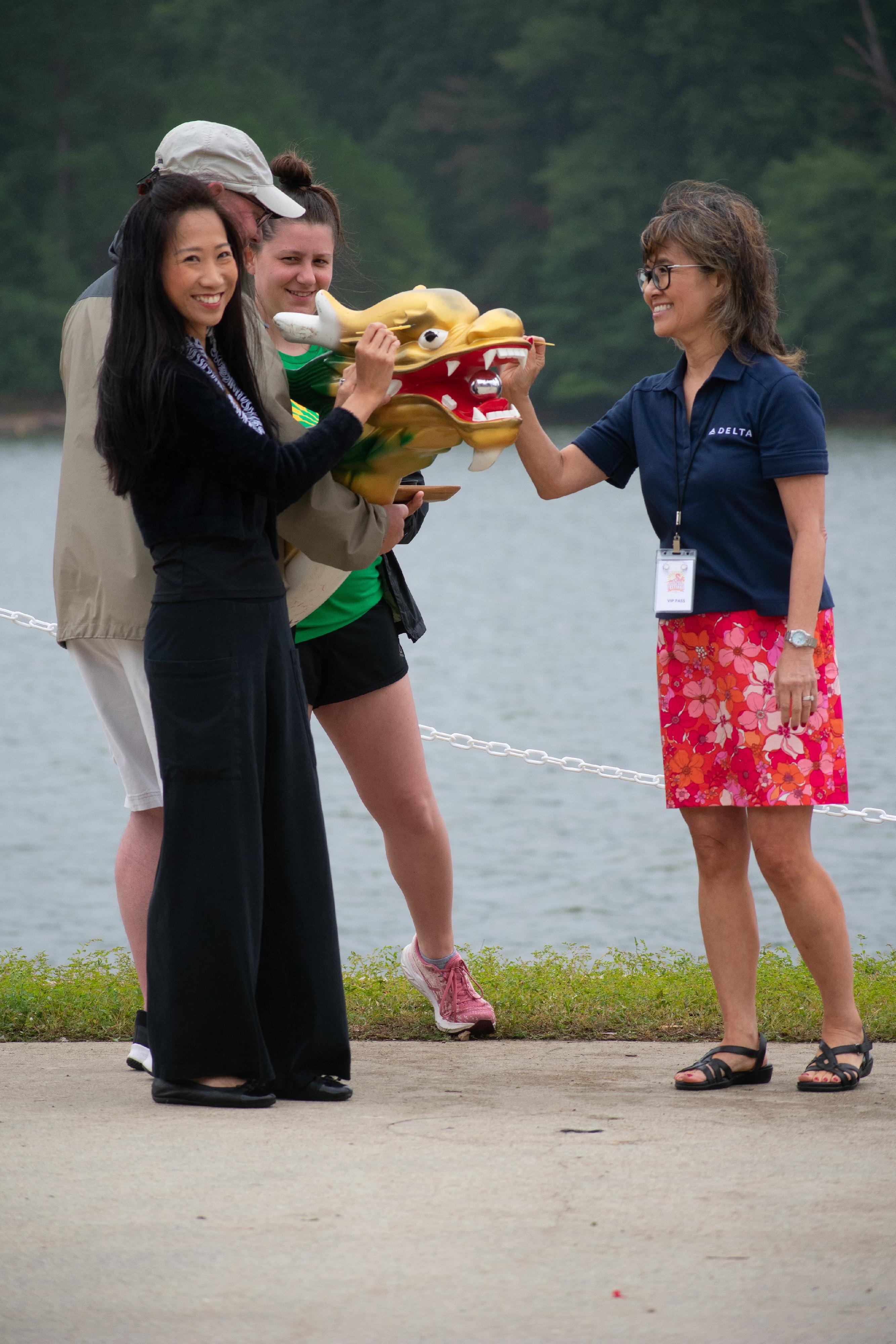 The Director of the Hong Kong Economic and Trade Office in New York, Ms Candy Nip (first left), officiates at the eye-dotting ceremony of the Atlanta Hong Kong Dragon Boat Festival.