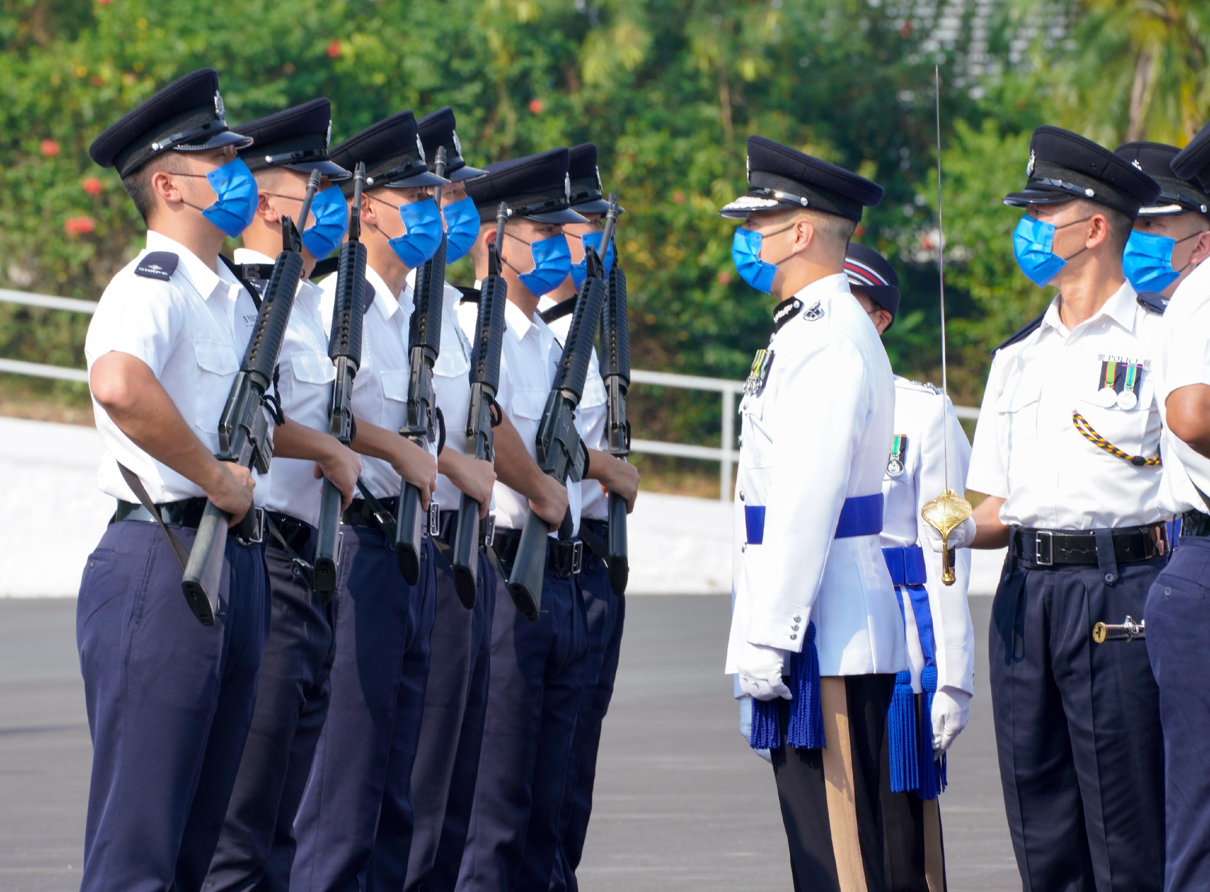 The Deputy Commissioner of Police (Management), Mr Chow Yat-ming, today (September 17) inspects a passing-out parade of 35 probationary inspectors and 58 recruit police constables at the Hong Kong Police College.