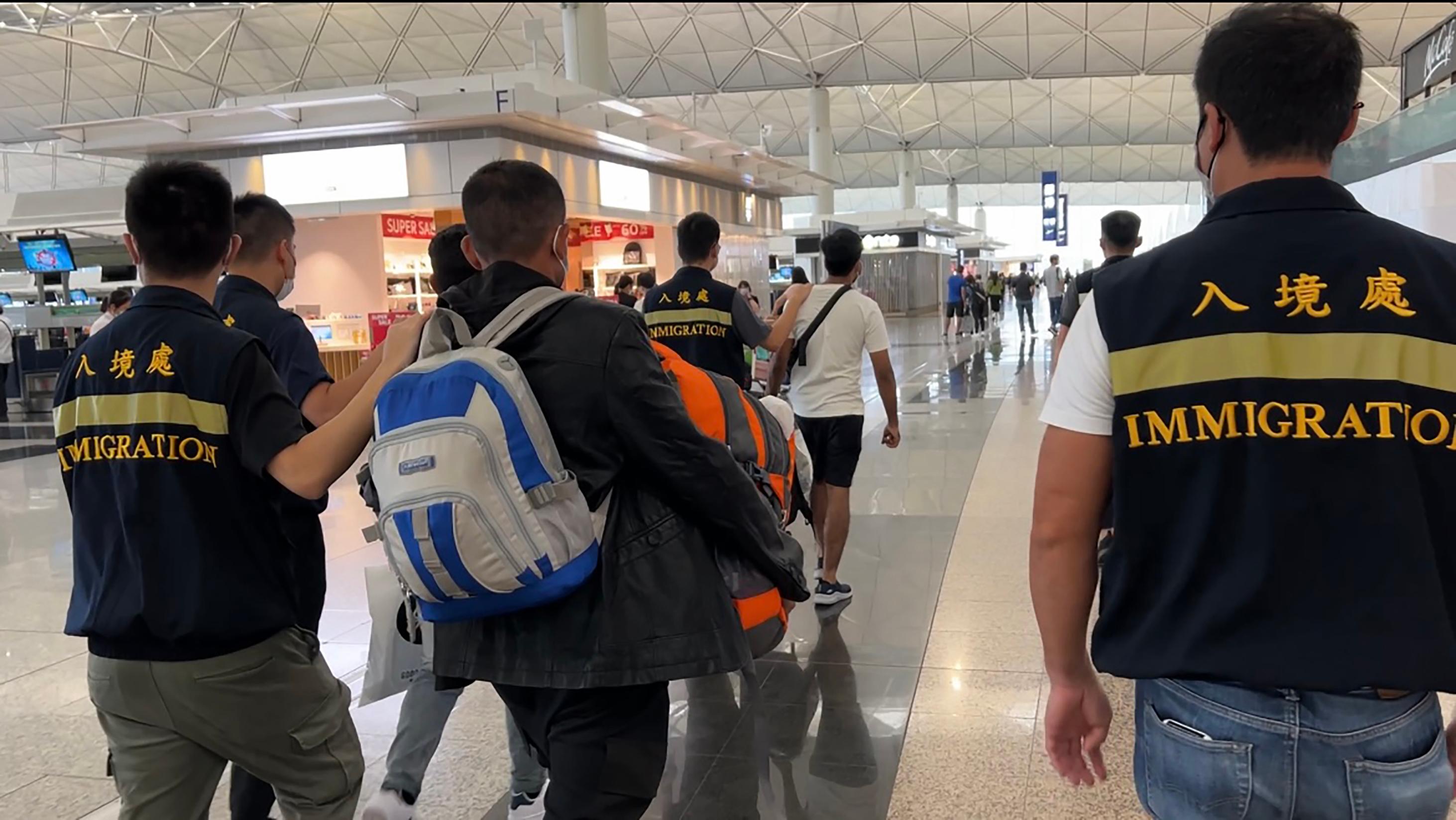 The Immigration Department (ImmD) carried out repatriation operations from September 13 to yesterday (September 20). A total of 45 unsubstantiated non-refoulement claimants were repatriated to their places of origin. Photo shows removees being escorted by ImmD officers to depart Hong Kong.