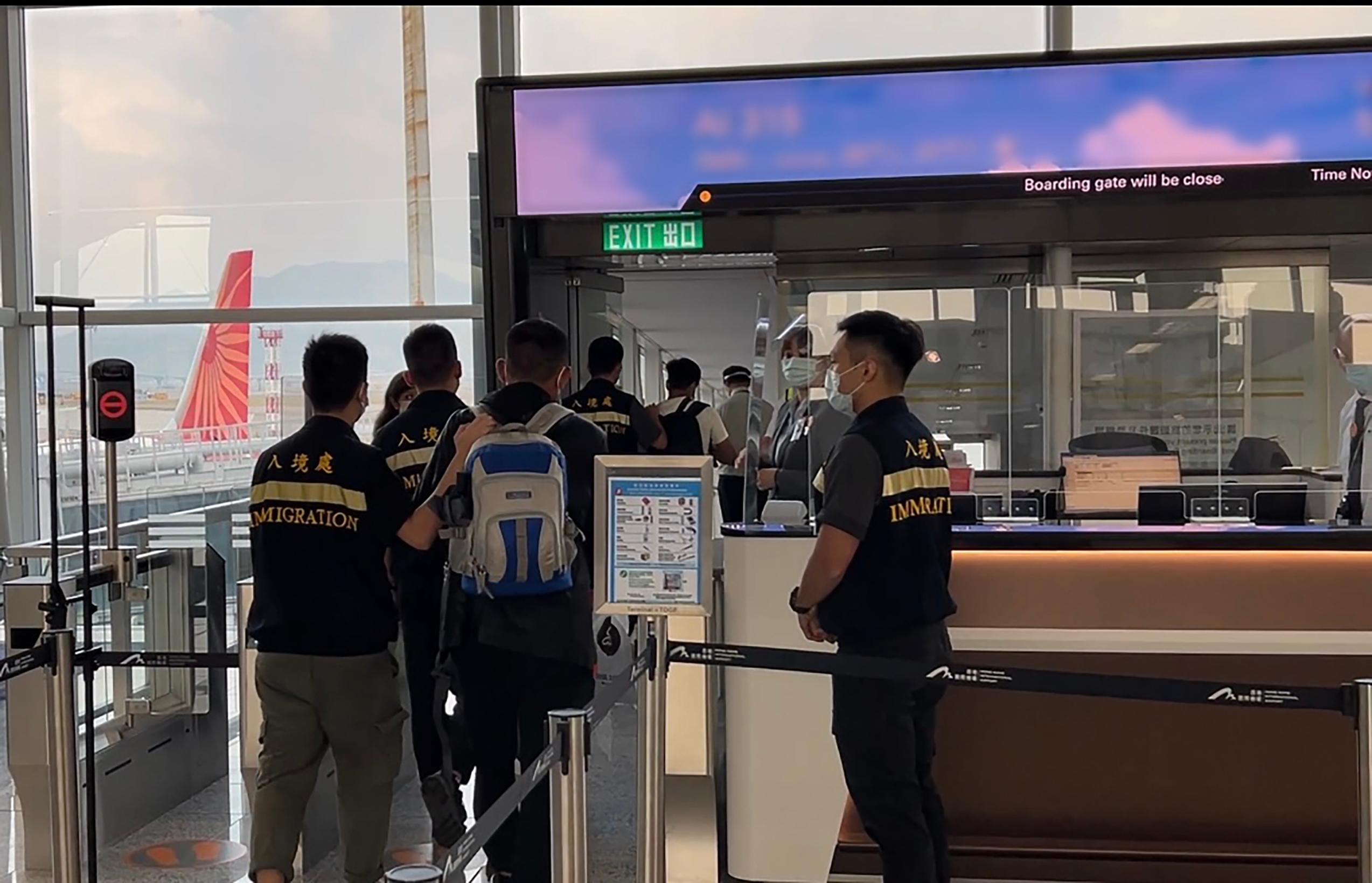 The Immigration Department (ImmD) carried out repatriation operations from September 13 to yesterday (September 20). A total of 45 unsubstantiated non-refoulement claimants were repatriated to their places of origin. Photo shows removees being escorted by ImmD officers to depart Hong Kong.