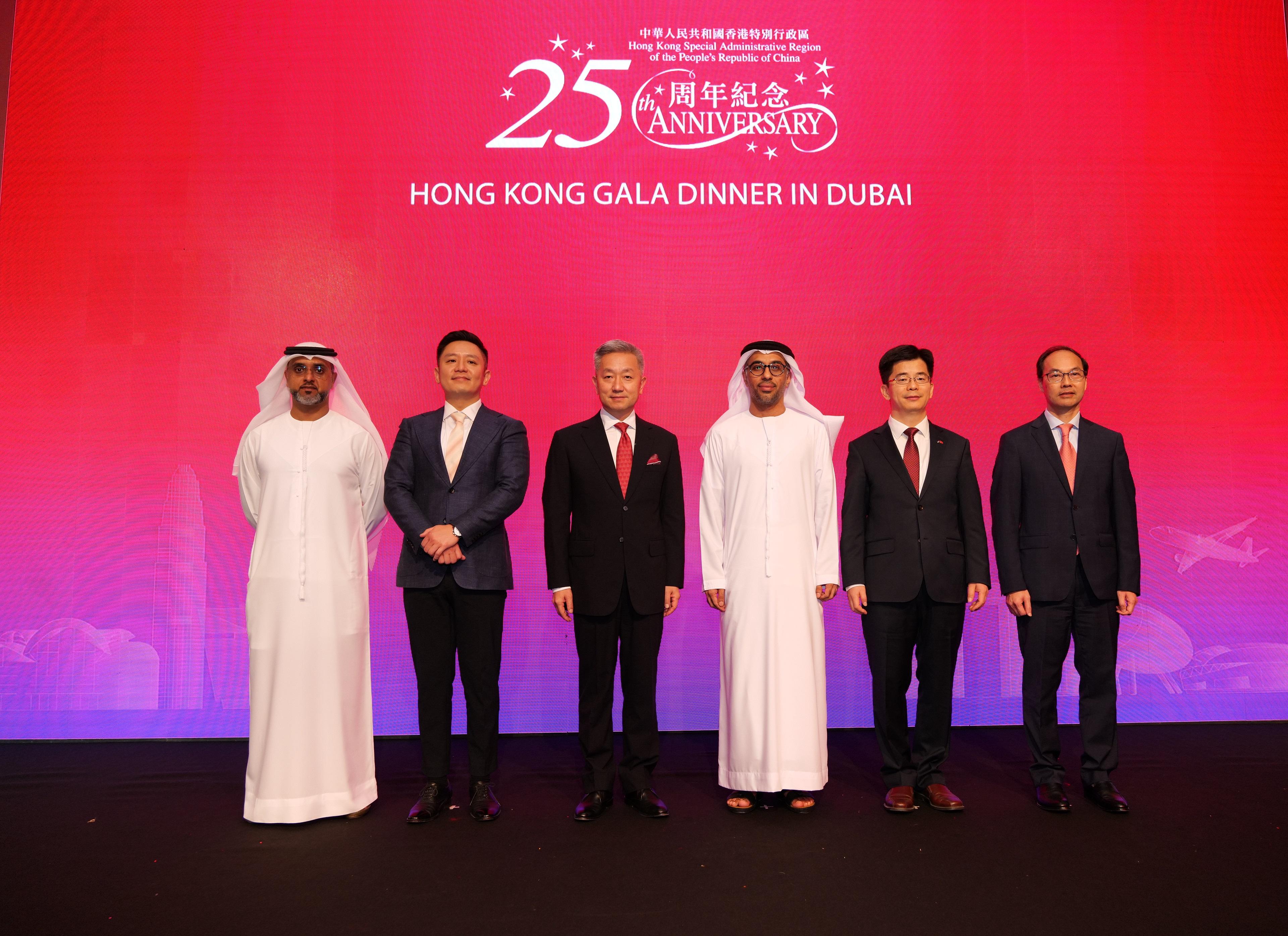 The Hong Kong Economic and Trade Office in Dubai (Dubai ETO) held a gala dinner in Dubai on September 21 (Dubai time) to celebrate the 25th anniversary of the establishment of the Hong Kong Special Administrative Region. Photo shows guests attending the event on the stage. They are (from left) the Deputy Chief Executive Officer of the Dubai Industries and Exports, Mr Mohammad Al Kamali; the Director-General of the Dubai ETO, Mr Damian Lee; the Ambassador Extraordinary and Plenipotentiary of the People's Republic of China to the United Arab Emirates, Mr Zhang Yiming; the Assistant Undersecretary for Entrepreneurship and SMEs, the Ministry of Economy of the United Arab Emirates, His Excellency Mr Faisal Al Hammadi; the Consul General of the People's Republic of China in Dubai, Mr Li Xuhang; and the Regional Director of Middle East and Africa of the Hong Kong Trade Development Council, Mr Daniel Lam.