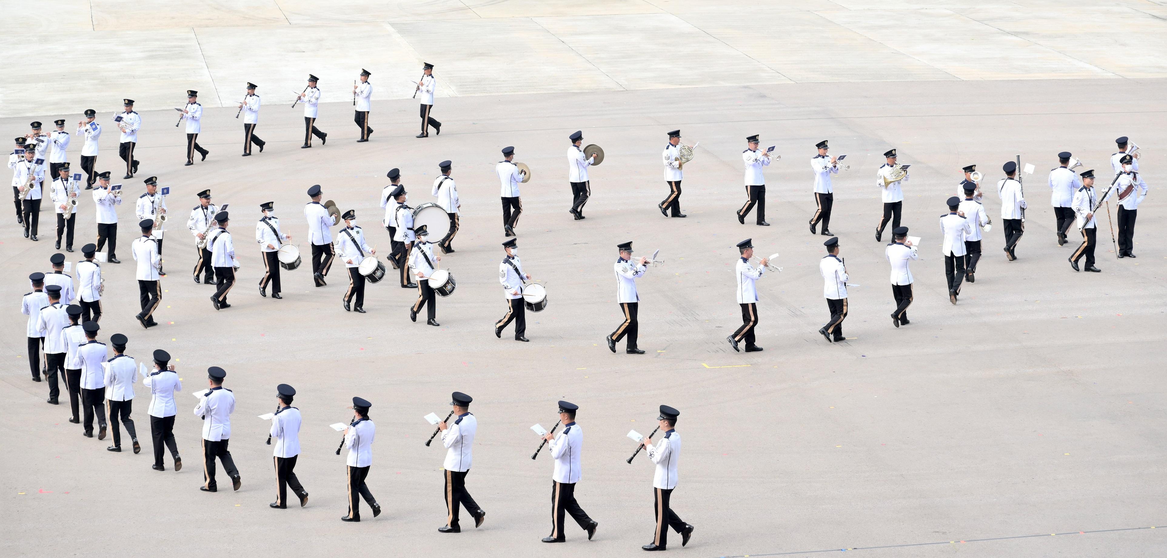 The Security Bureau led the disciplined services, auxiliary services and nine youth groups to hold the "Together We Prosper" Grand Parade by Disciplined Services and Youth Groups for Celebrating the 73rd Anniversary of the Founding of the People’s Republic of China and the 25th Anniversary of the Establishment of the Hong Kong Special Administrative Region at the Fire and Ambulance Services Academy in Tseung Kwan O today (September 24). Photo shows music performance by the Hong Kong Police Band.