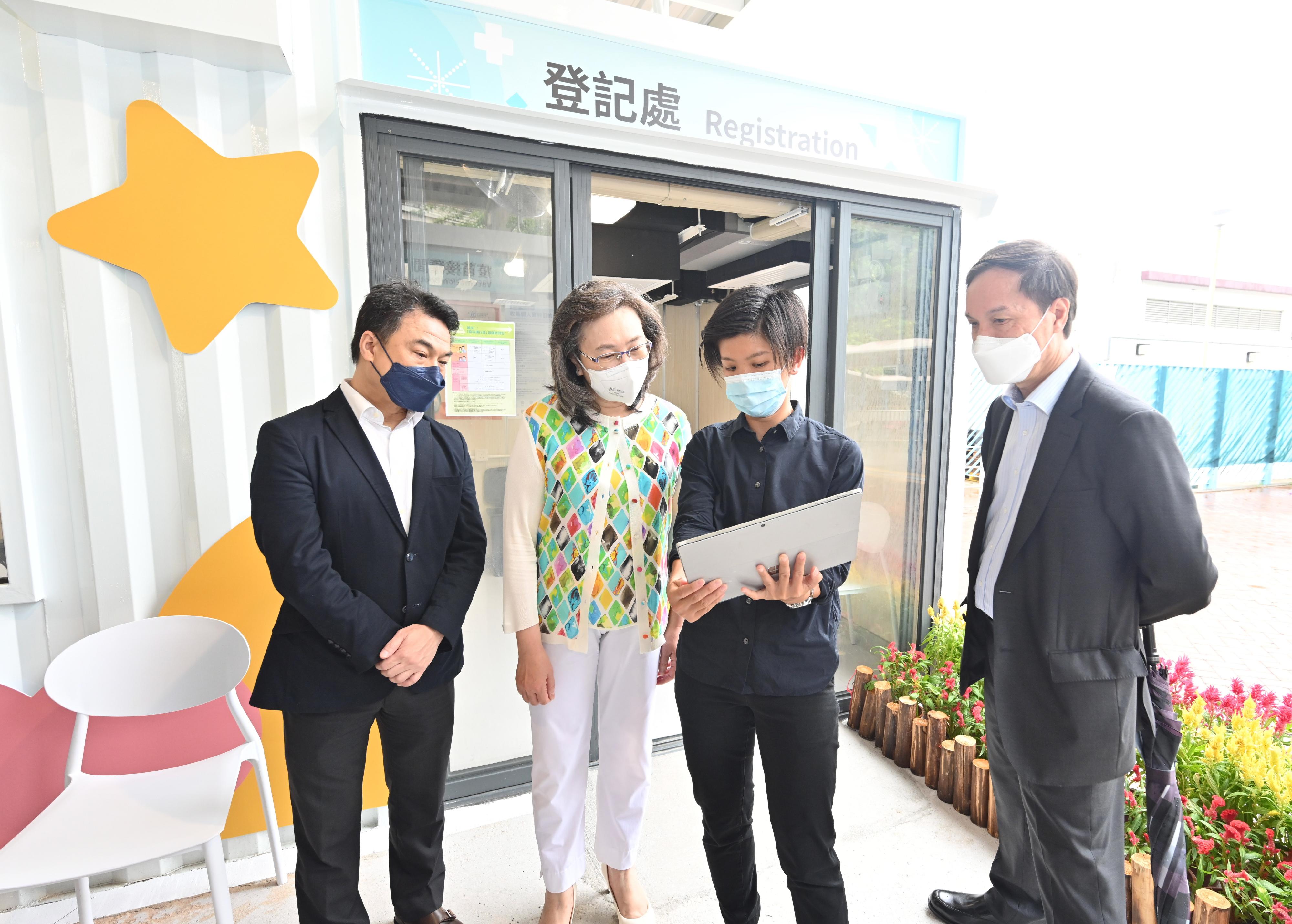 The Secretary for the Civil Service, Mrs Ingrid Yeung, visited the Lai Chi Kok Park Community Vaccination Station (CVS) today (September 29) to see its readiness for coming into operation tomorrow (September 30). Photo shows Mrs Yeung (second left) being briefed by Property Services Manager of the Architectural Services Department Ms Cheung Tin-man (second right) on the design of the CVS. Looking on are the person-in-charge of the medical partner of the CVS, Dr Samuel Kwok (first left), and the Director of General Grades of the Civil Service Bureau, Mr Hermes Chan (first right).