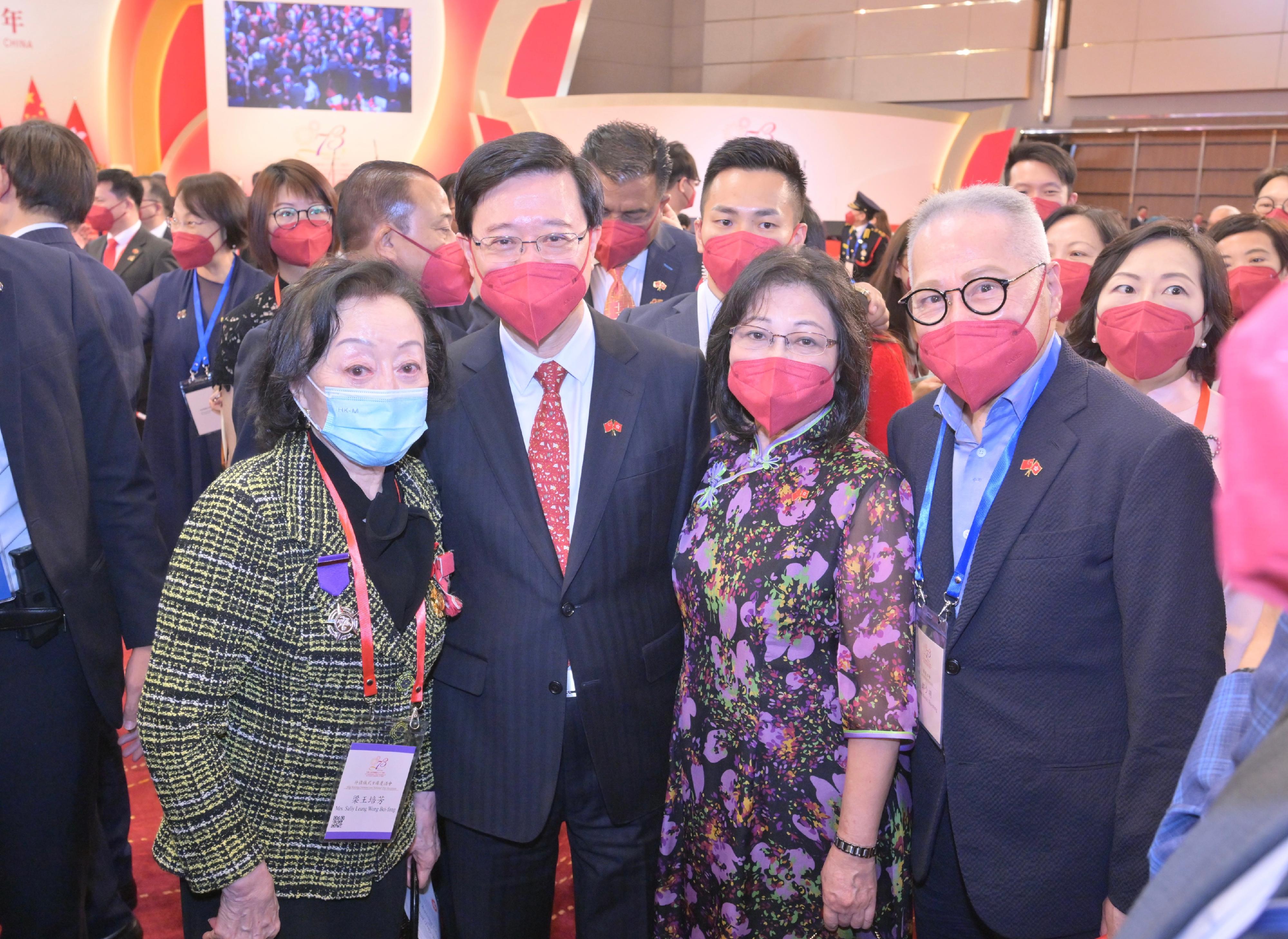 The Chief Executive, Mr John Lee (front, second left), and his wife Mrs Lee (front, second right), are pictured with guests at the reception in celebration of the 73rd anniversary of the founding of the People's Republic of China at the Hong Kong Convention and Exhibition Centre this morning (October 1).
