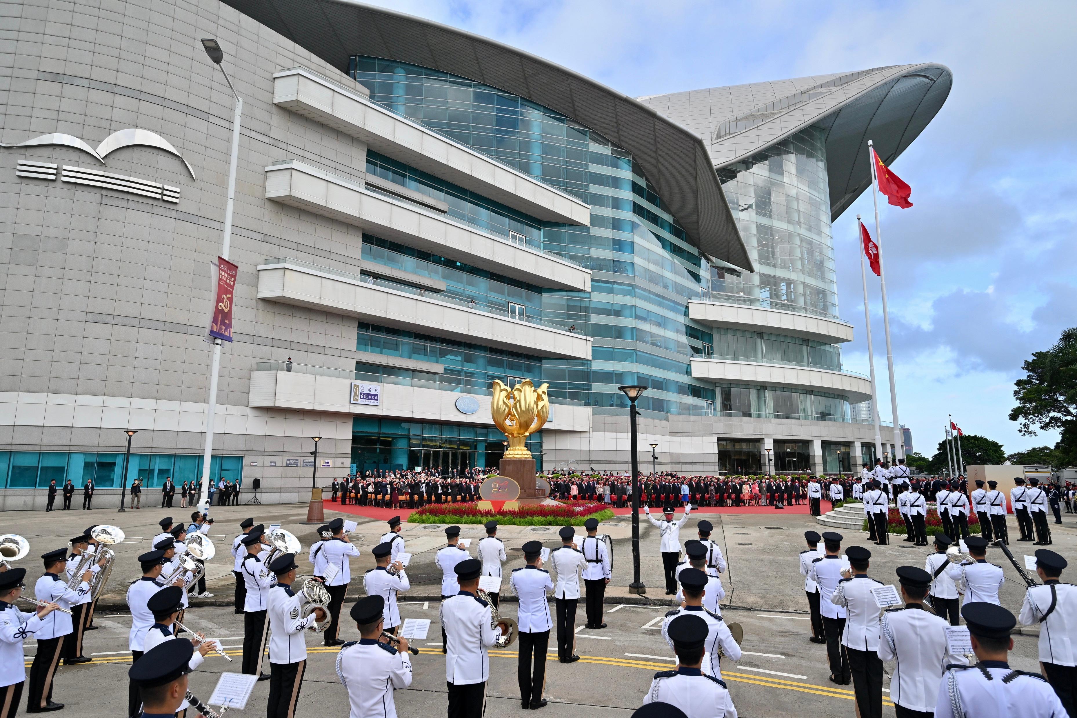 The Chief Executive, Mr John Lee, together with Principal Officials and guests, attends the flag-raising ceremony for the 73rd anniversary of the founding of the People's Republic of China at Golden Bauhinia Square in Wan Chai this morning (October 1).