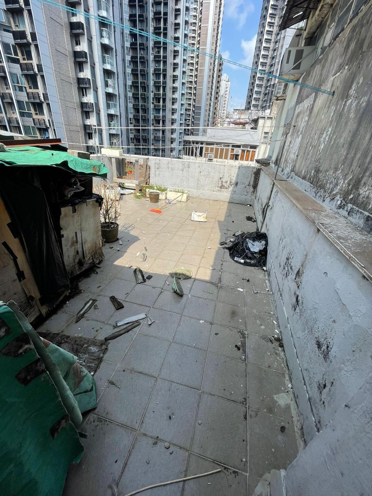 The Home Affairs Department and its District Offices conducted a series of cleaning works, publicity and educational activities during July and September to support the Government Programme on Tackling Hygiene Black Spots launched under the District Matters Co-ordination Task Force. Photo shows the rooftop of a "three-nil" building in Sham Shui Po before cleaning services were arranged by the Home Affairs Department.