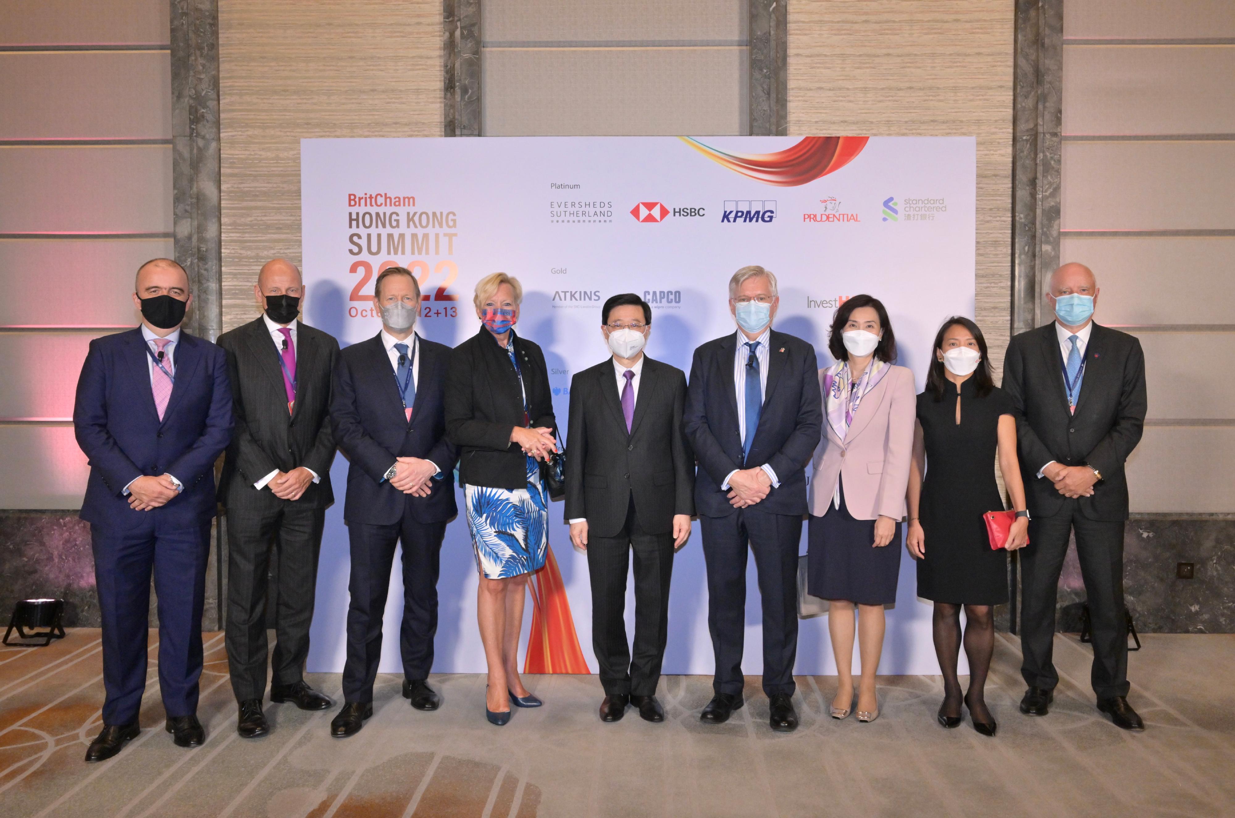 The Chief Executive, Mr John Lee, attended Hong Kong Summit organised by the British Chamber of Commerce in Hong Kong (BritCham) today (October 12). Photo shows Mr Lee (centre); the Chair of BritCham, Dr Anne Kerr (fourth left); former Chair of BritCham Mr Peter Burnett (fourth right), and other guests at the event.