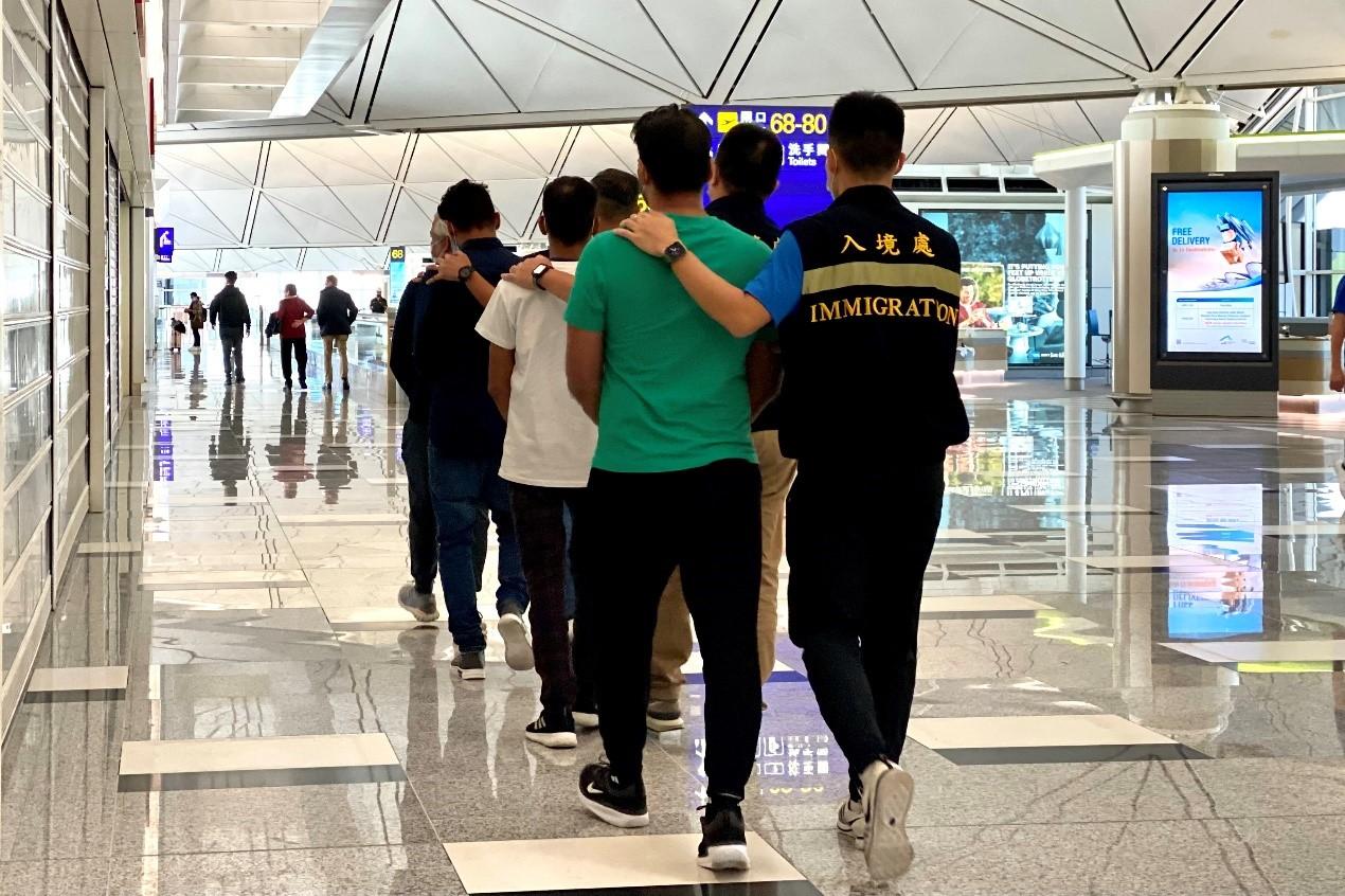 The Immigration Department (ImmD) carried out repatriation operations from October 10 to yesterday (October 13). A total of 24 unsubstantiated non-refoulement claimants were repatriated to their places of origin. Photo shows removees being escorted by ImmD officers to depart Hong Kong.