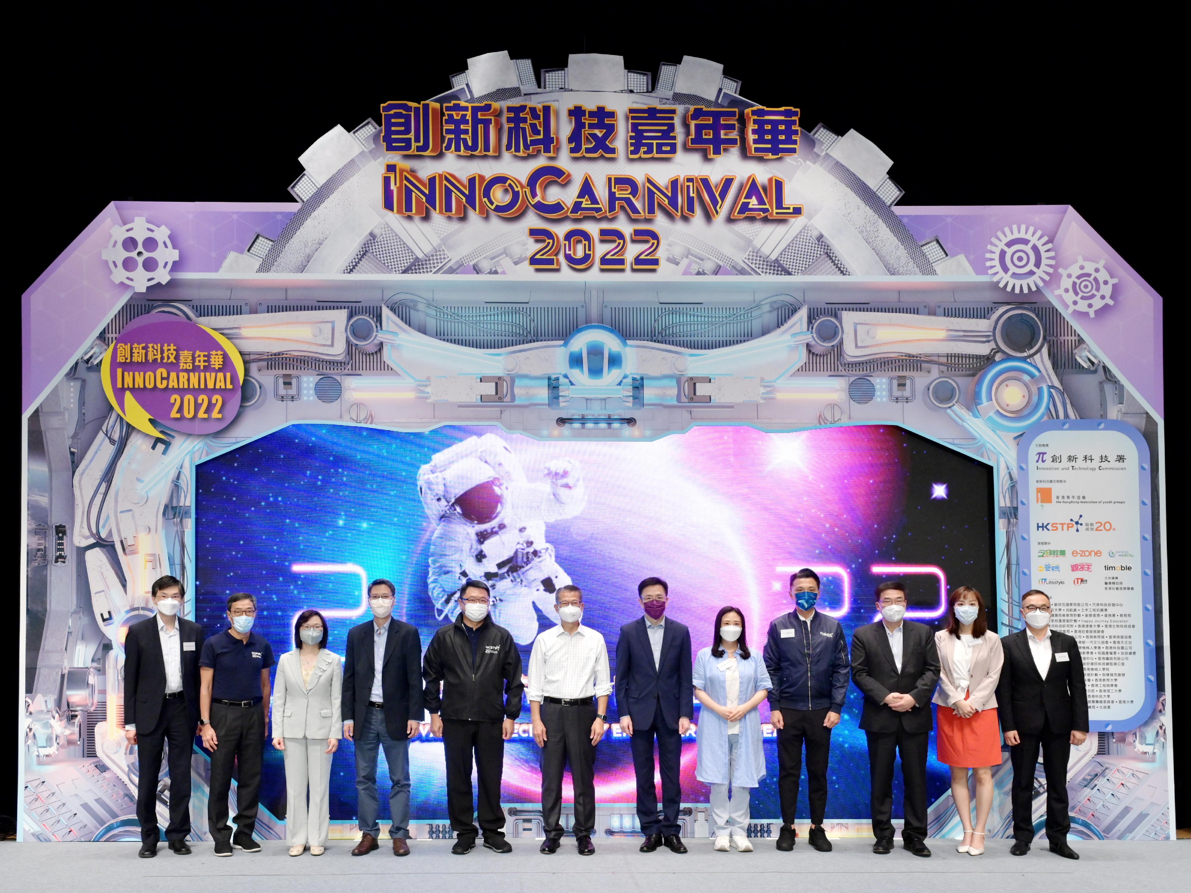 The Financial Secretary, Mr Paul Chan, attended the opening ceremony of InnoCarnival 2022 today (October 22). Photo shows (from left) the Chief Executive of the Hong Kong Council of Social Service, Mr Chua Hoi-wai; the Chief Executive Officer of the Hong Kong Science and Technology Parks Corporation (HKSTP), Mr Albert Wong; the Commissioner for Innovation and Technology, Ms Rebecca Pun; the Permanent Secretary for Innovation, Technology and Industry, Mr Eddie Mak; the Chairman of the Board of Directors of the HKSTP, Dr Sunny Chai; Mr Chan; the Secretary for Innovation, Technology and Industry, Professor Sun Dong; Legislative Council Members Ms Elizabeth Quat, Mr Sunny Tan and Dr Dennis Lam; the Under Secretary for Innovation, Technology and Industry, Ms Lillian Cheong; and the Executive Director of the Hong Kong Federation of Youth Groups, Mr Andy Ho, at the opening ceremony.