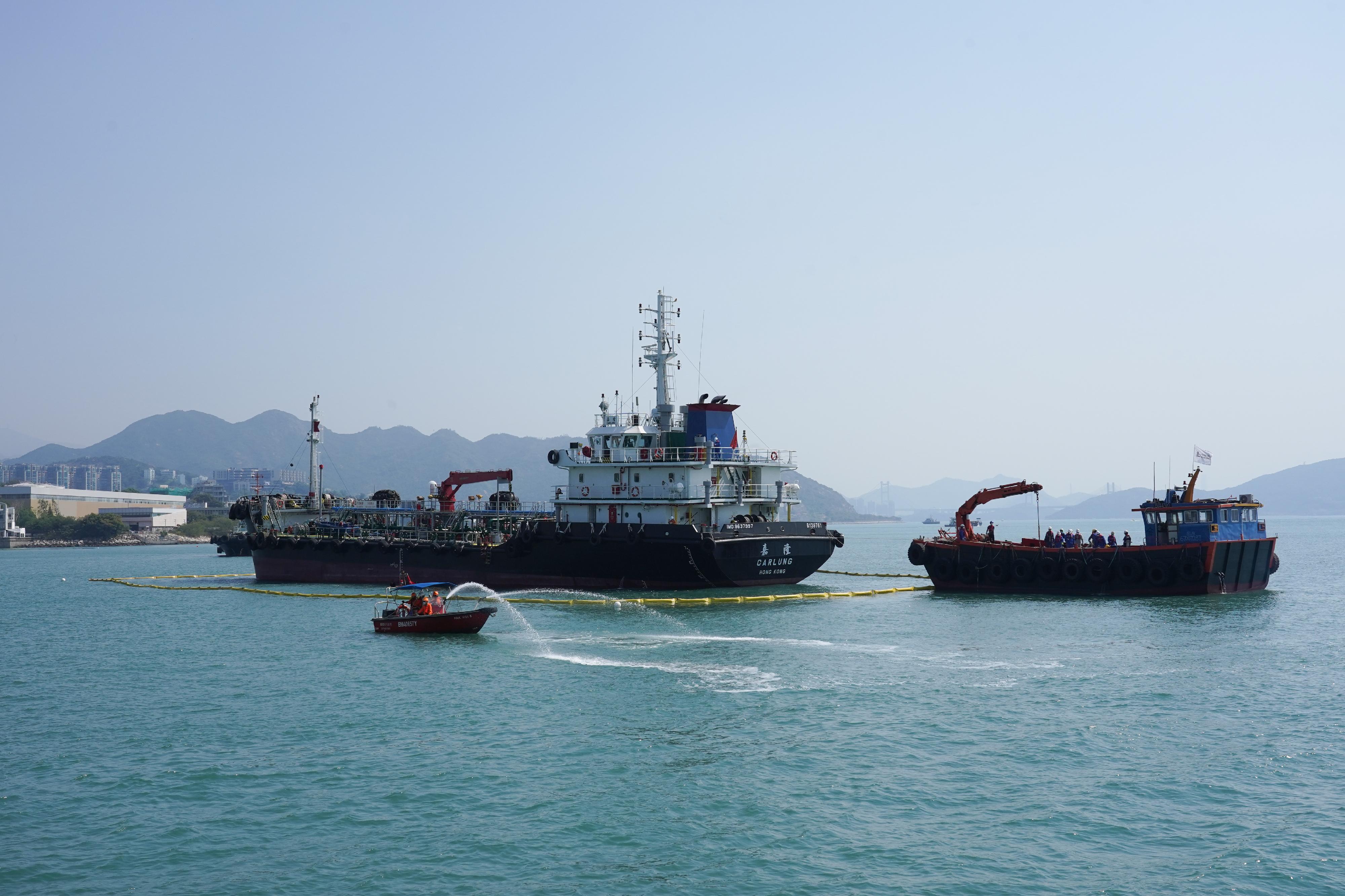 The annual marine pollution joint response exercises, code-named Oilex 2022 and Maritime Hazardous and Noxious Substances (HNS) 2022, were conducted by various government departments this morning (October 28) off Pearl Island, Tuen Mun, to test their marine pollution responses in the event of spillage of oil and HNS in Hong Kong waters. Photo shows a pollution control vessel simulating the spraying of oil dispersant with water.