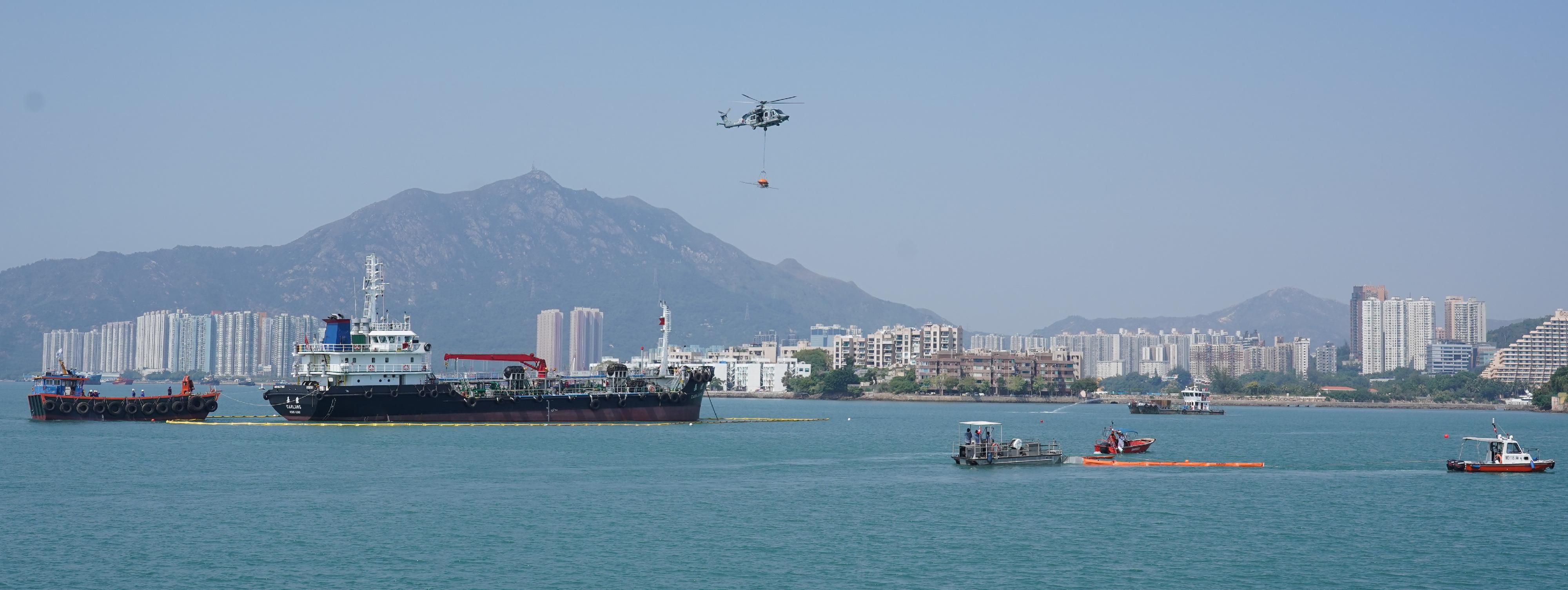 The annual marine pollution joint response exercises, code-named Oilex 2022 and Maritime Hazardous and Noxious Substances (HNS) 2022, were conducted by various government departments this morning (October 28) off Pearl Island, Tuen Mun, to test their marine pollution responses in the event of spillage of oil and HNS in Hong Kong waters. Photo shows an oil spill response team cleaning up the spilled oil on the sea surface. The Government Flying Service and other response groups were also tasked at the scene.