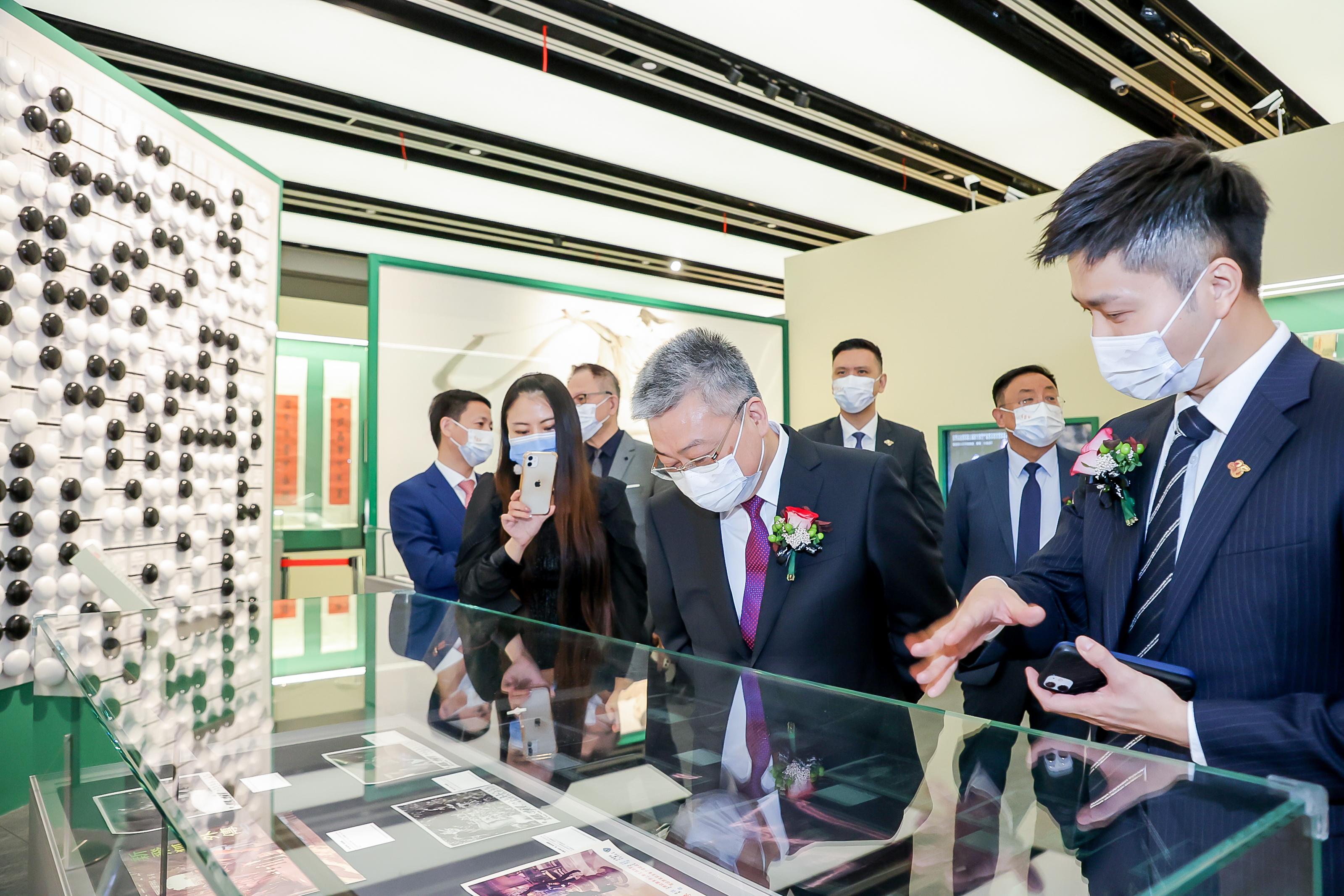 "Jin Yong Exhibition", organised by the Hong Kong Economic and Trade Office in Shanghai (SHETO), was unveiled today (October 28) at Shanghai Library East in Shanghai. Photo shows the Acting Director of the SHETO, Mr Kelvin Lo (first right), touring the exhibition with the Director General of the Hong Kong and Macao Affairs Office of the Shanghai Municipal Government, Mr Zhang Xiaosong (second right), and other guests.