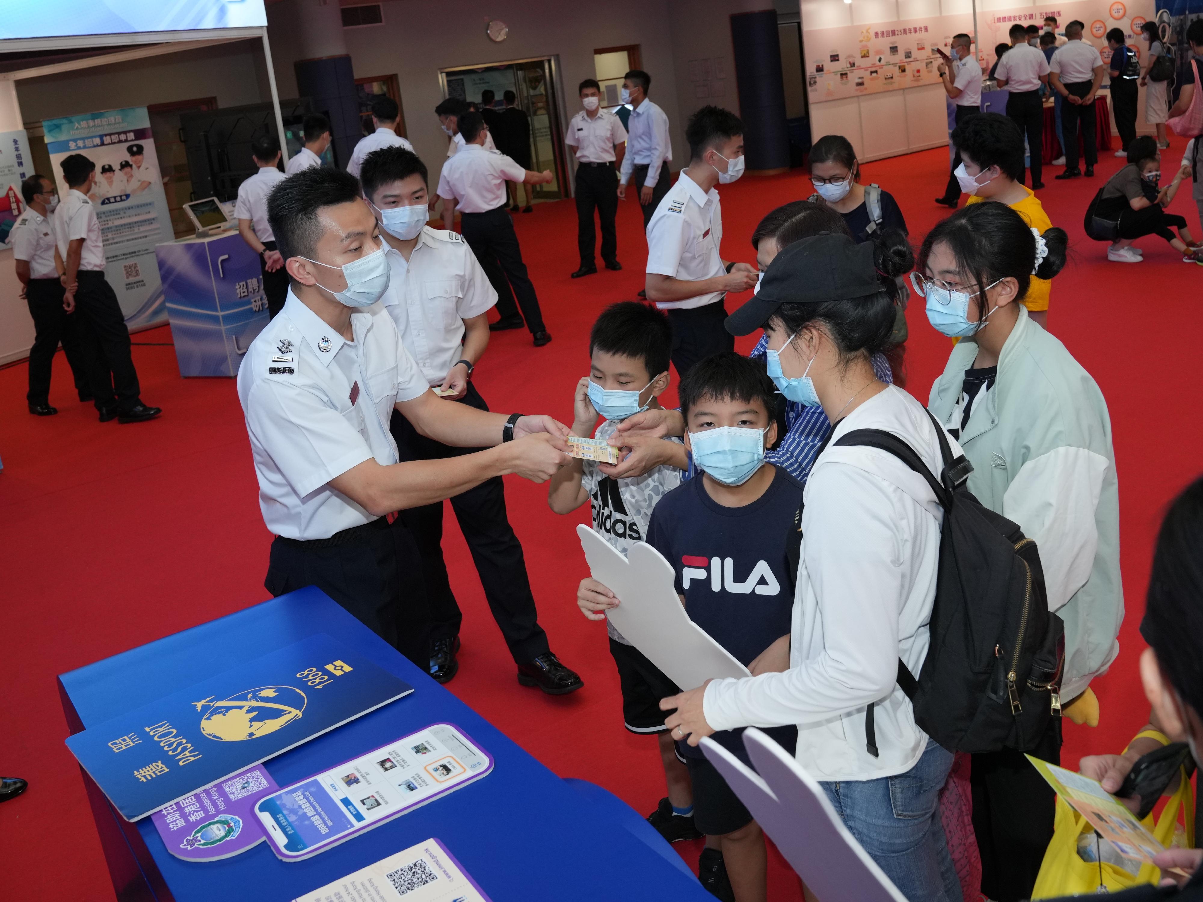 The Immigration Service Institute of Training and Development held an Open Day today (October 29). Photo shows members of the public touring the exhibition booths during the Open Day.