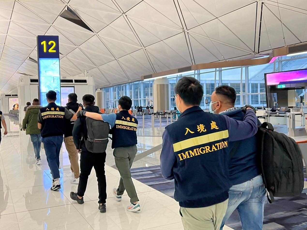 The Immigration Department (ImmD) carried out repatriation operations from November 1 to yesterday (November 4). A total of 26 unsubstantiated non-refoulement claimants were repatriated to their places of origin. Photo shows removees being escorted by ImmD officers to depart Hong Kong.
