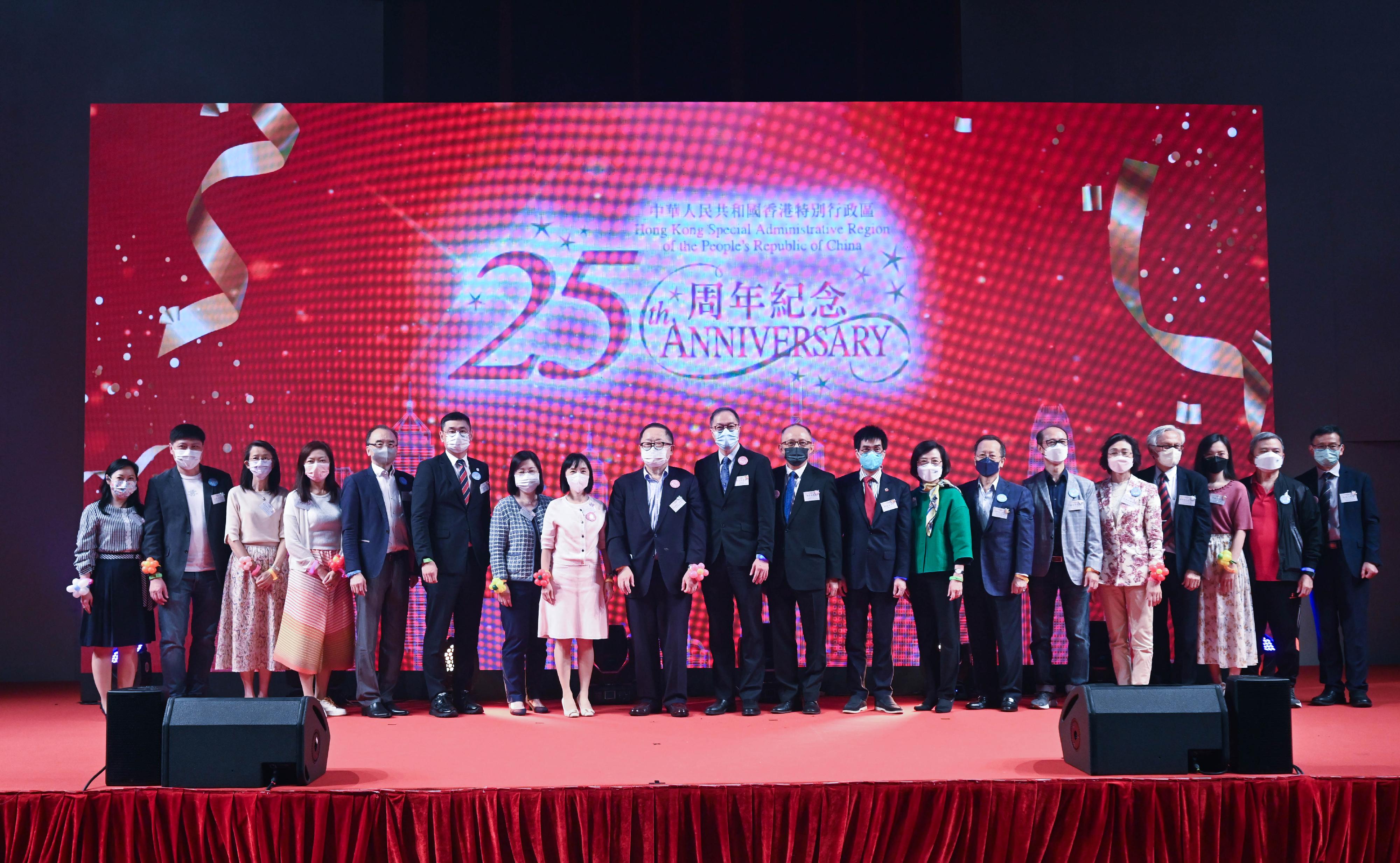 The Social Welfare Department today (November 9) held the 2022 Award Presentation Ceremony of the Opportunities for the Elderly Project (OEP). Photo shows the Director of Social Welfare, Miss Charmaine Lee (eighth left); the Chairman of the OEP Advisory Committee, Professor Diana Lee (seventh left) and the Chairman of the Elderly Commission, Dr Donald Li (ninth left), joined other guests in celebrating the 25th anniversary of the establishment of the Hong Kong Special Administrative Region at the ceremony.