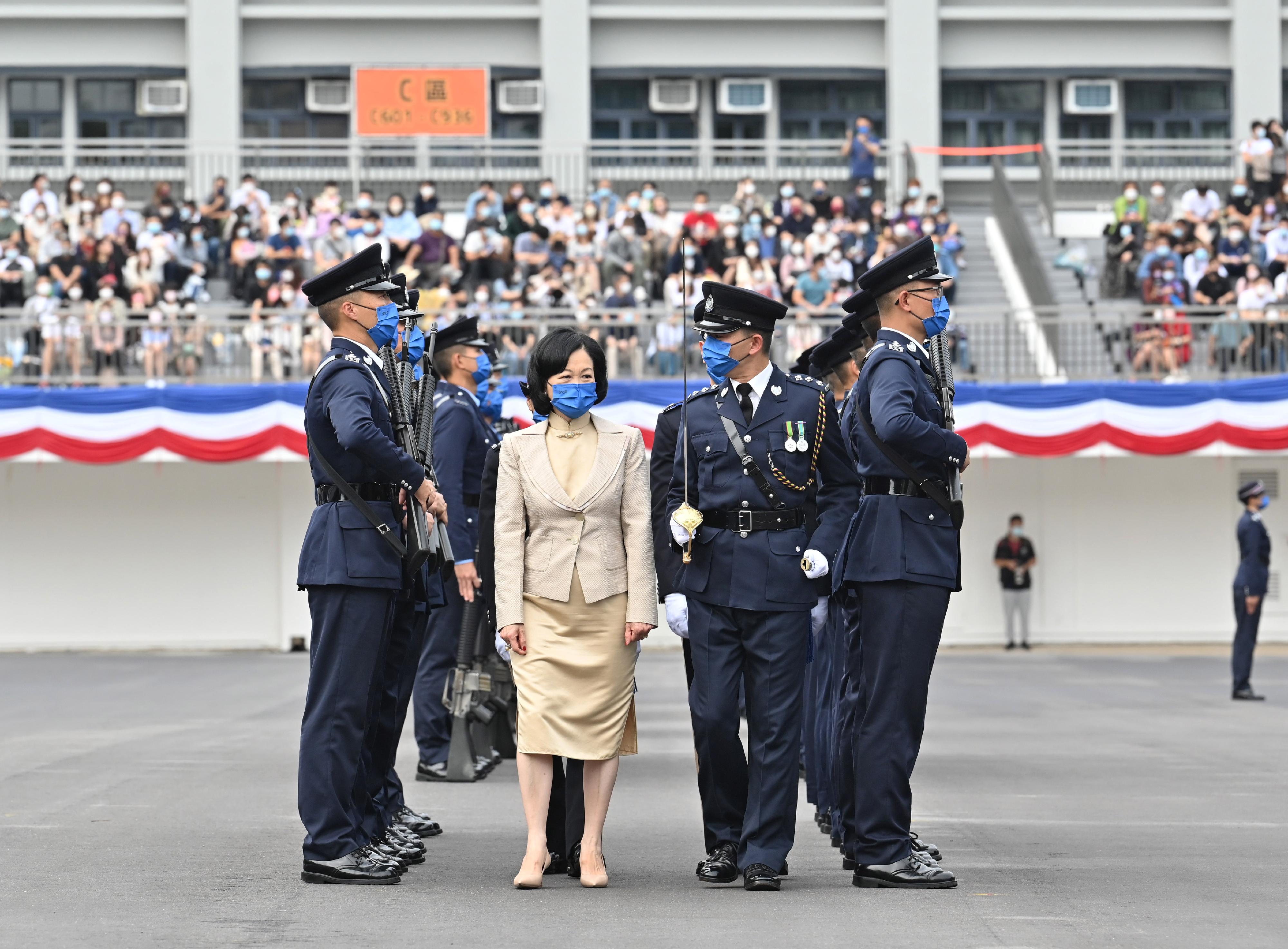 The Convenor of the Non-official Members of the Executive Council, Mrs Regina Ip, inspects a passing-out parade as a reviewing officer at the Hong Kong Police College today (November 26).
