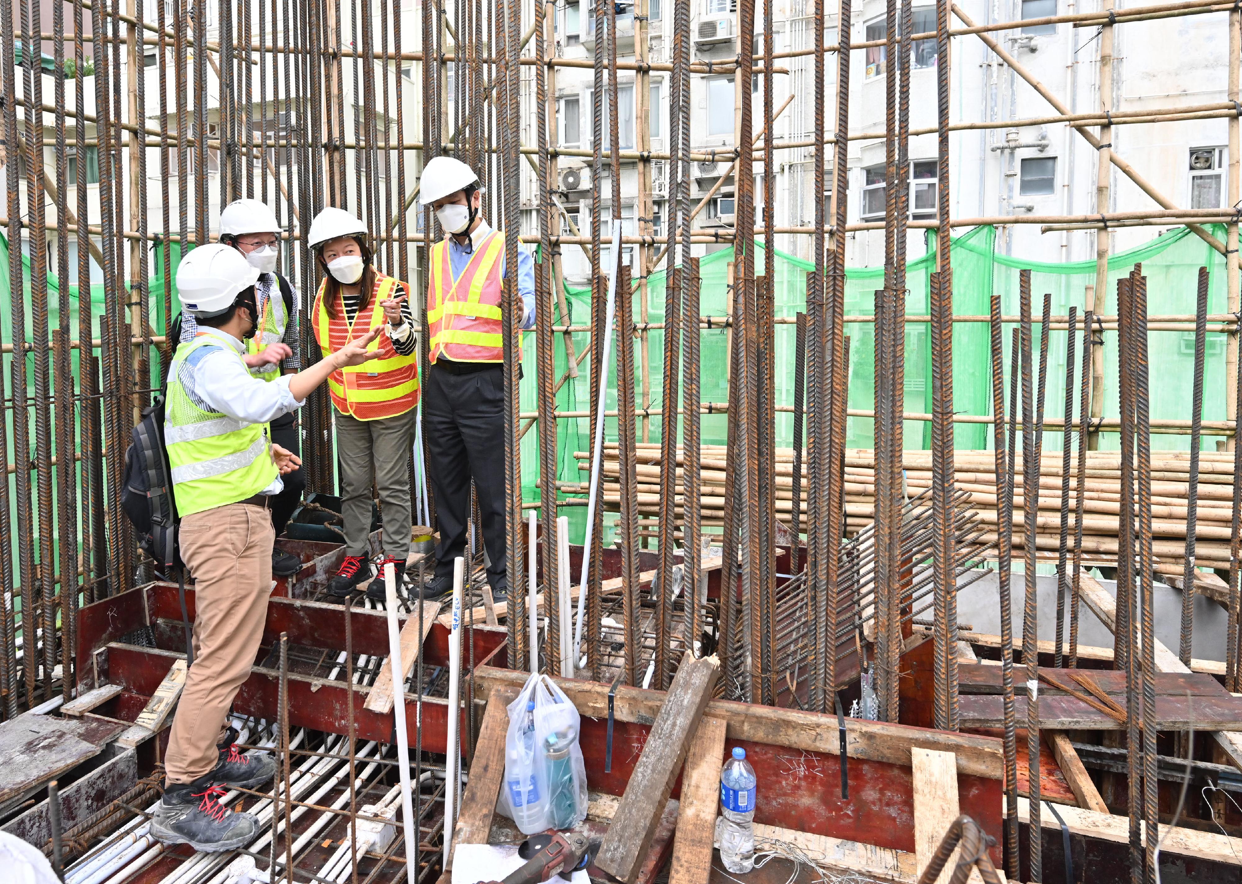 The Labour Department concluded a special enforcement operation targeting construction sites of new works and work-at-height safety to curb unsafe work practices on construction sites in November. Photo shows the Commissioner for Labour, Ms May Chan (second right), and the Deputy Commissioner for Labour (Occupational Safety and Health), Mr Vincent Fung (first right), inspecting a construction site.