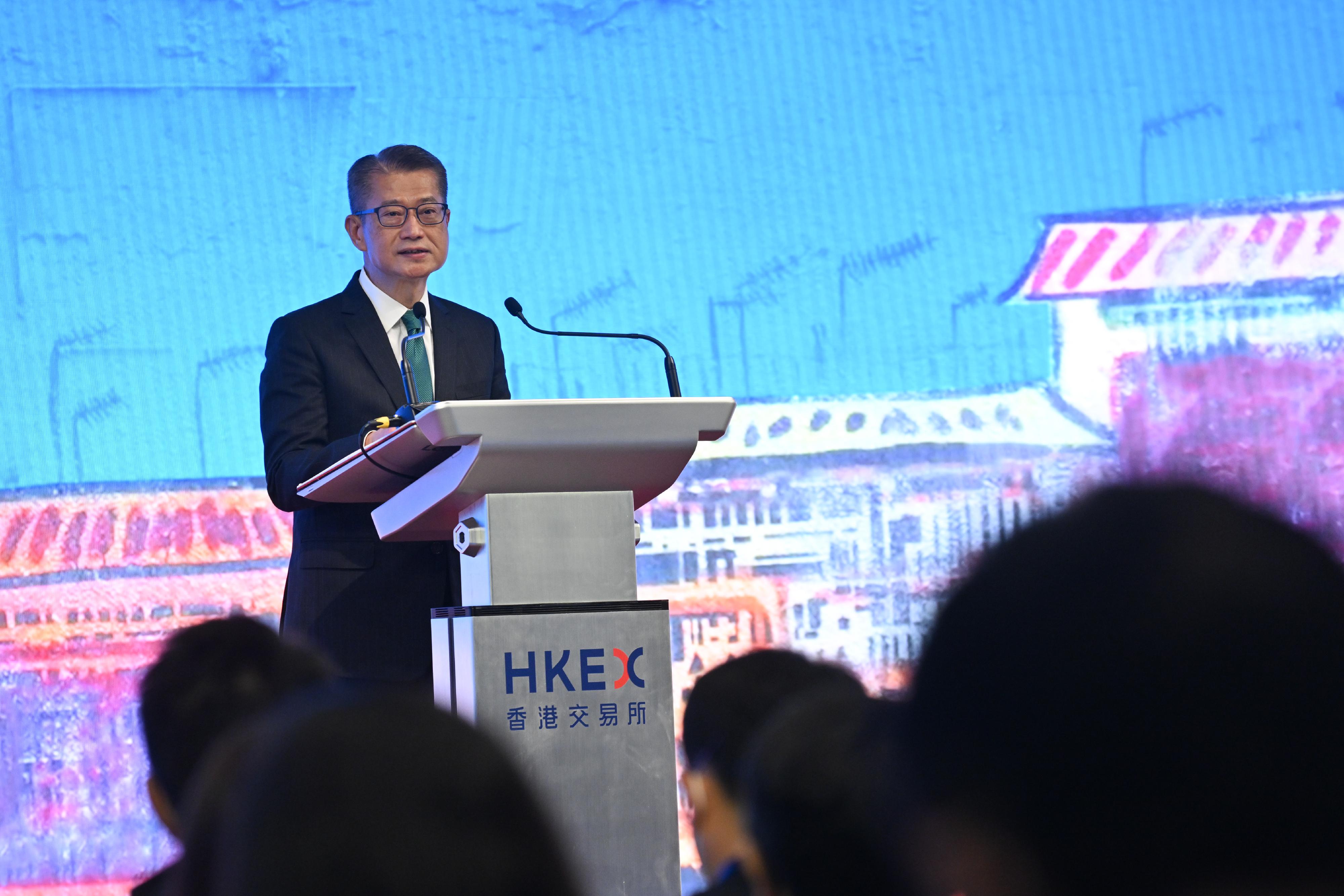 The Financial Secretary, Mr Paul Chan, speaks at the HKEX Impact Summit today (December 2).