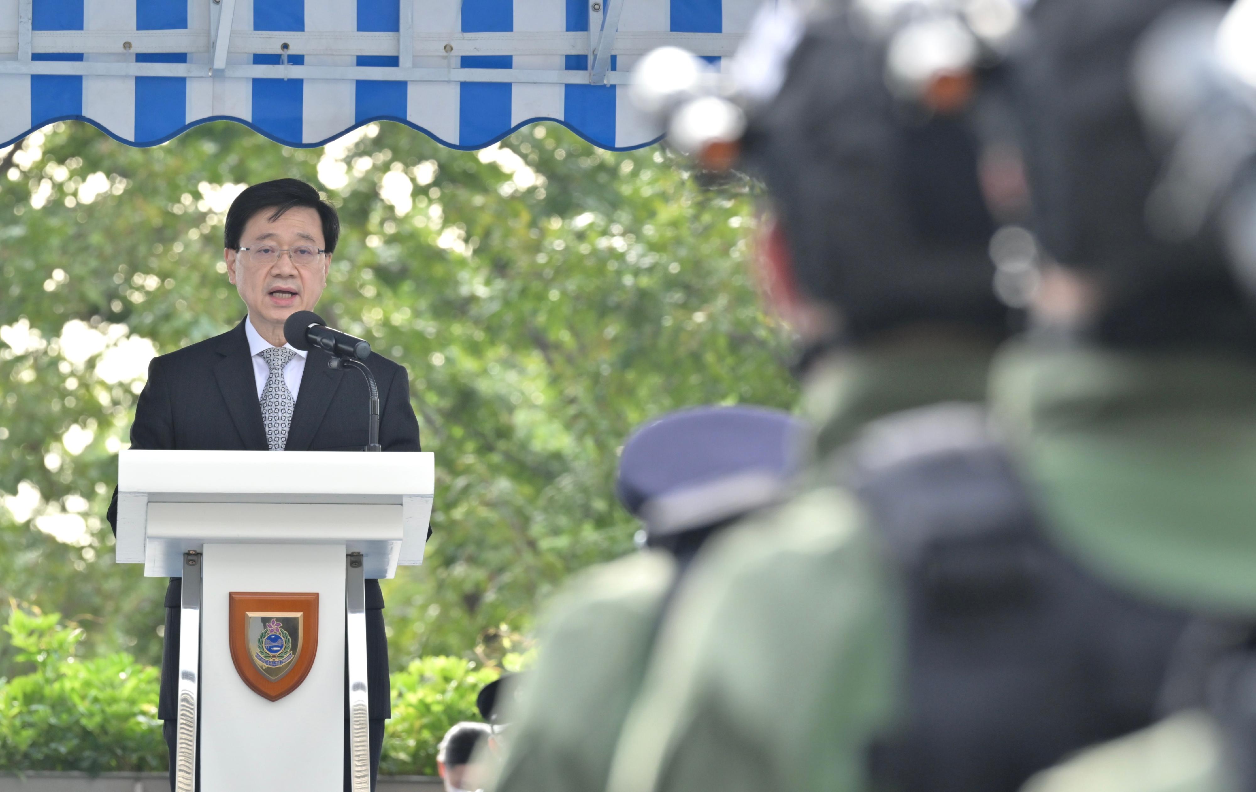 The Chief Executive, Mr John Lee, delivers a speech at the Immigration Department Passing-out Parade today (December 2).