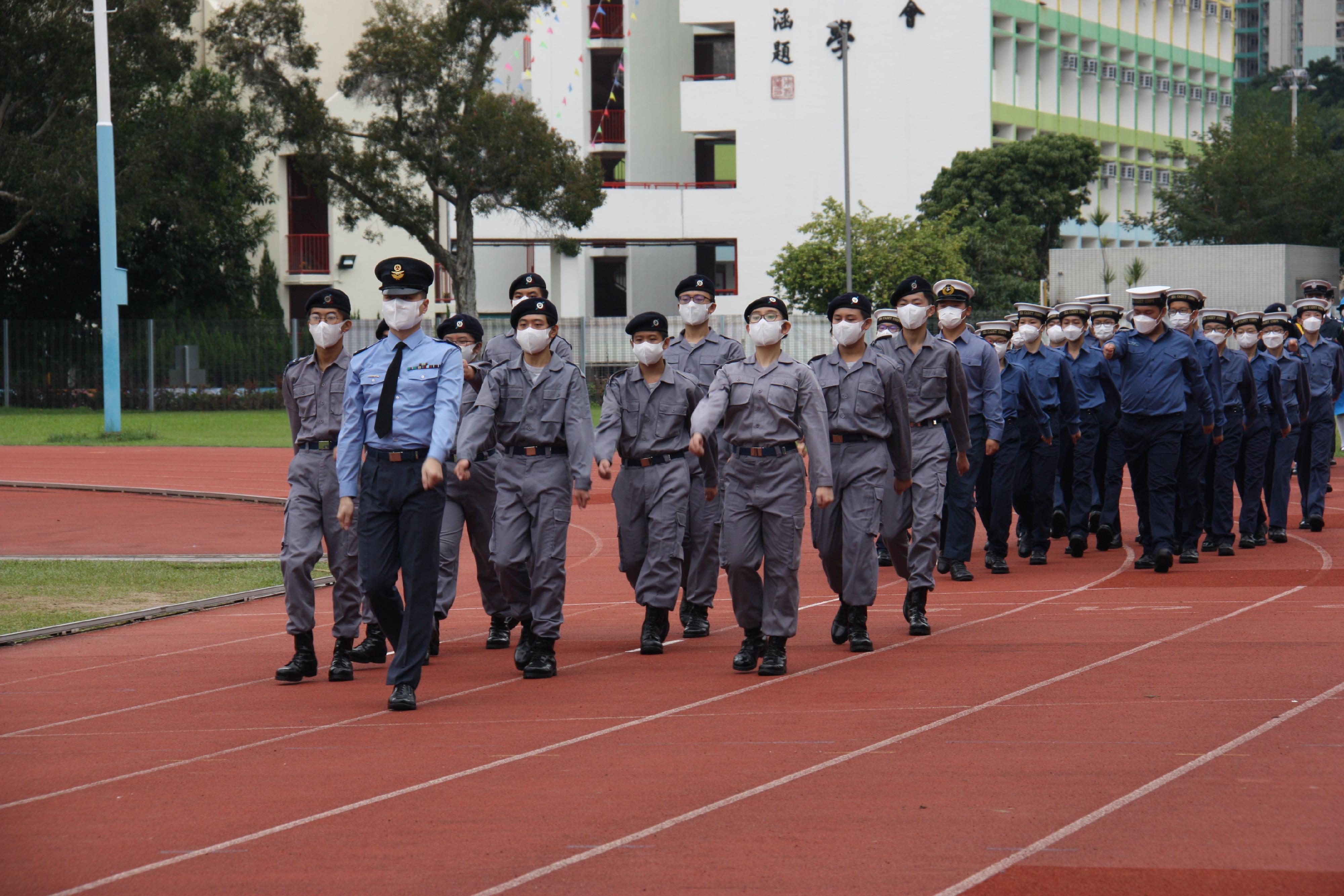 With the aim of enhancing different social sectors' awareness of the Constitution and promoting the constitutional spirit, the Kwun Tong District Office, together with local district organisations, organised promotional and educational activities on the Constitution today (December 4). Photo shows youth uniformed groups marching in at the "Promotion of Constitution Day 2022 by Different Sectors of Kwun Tong – Display of National Flag" activity. 