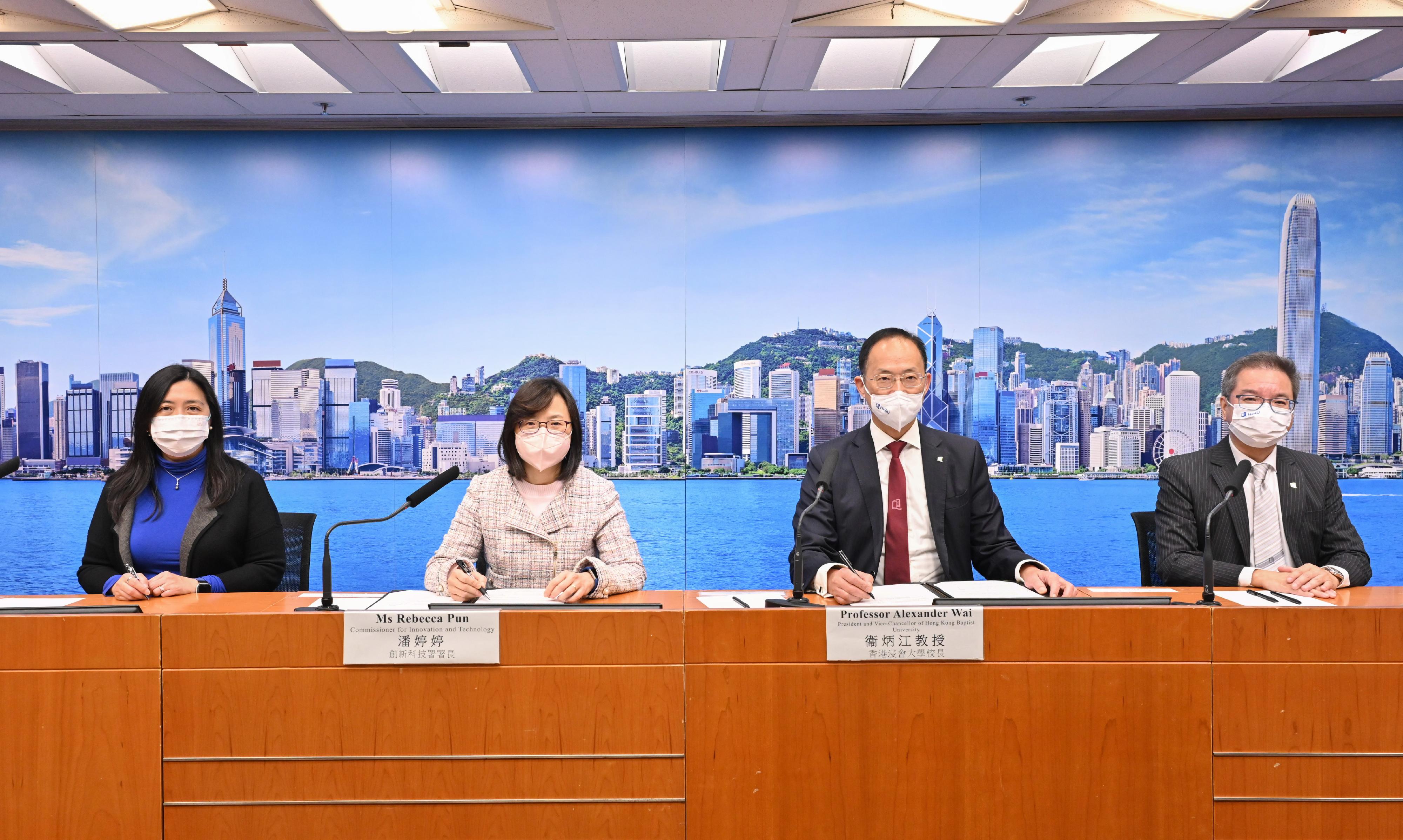 The Innovation and Technology Support Programme has approved funding for an art technological innovation project to develop Future Cinema Systems. Photo shows the Commissioner for Innovation and Technology, Ms Rebecca Pun (second left); the Assistant Commissioner for Innovation and Technology (Research and Development Centres), Mrs Elina Chan (first left); the President and Vice-Chancellor of the Hong Kong Baptist University, Professor Alexander Wai (second right); and the Interim Chief Innovation Officer of the Hong Kong Baptist University, Professor Terence Lau (first right), attending the signing ceremony of the funding agreement today (December 12).
