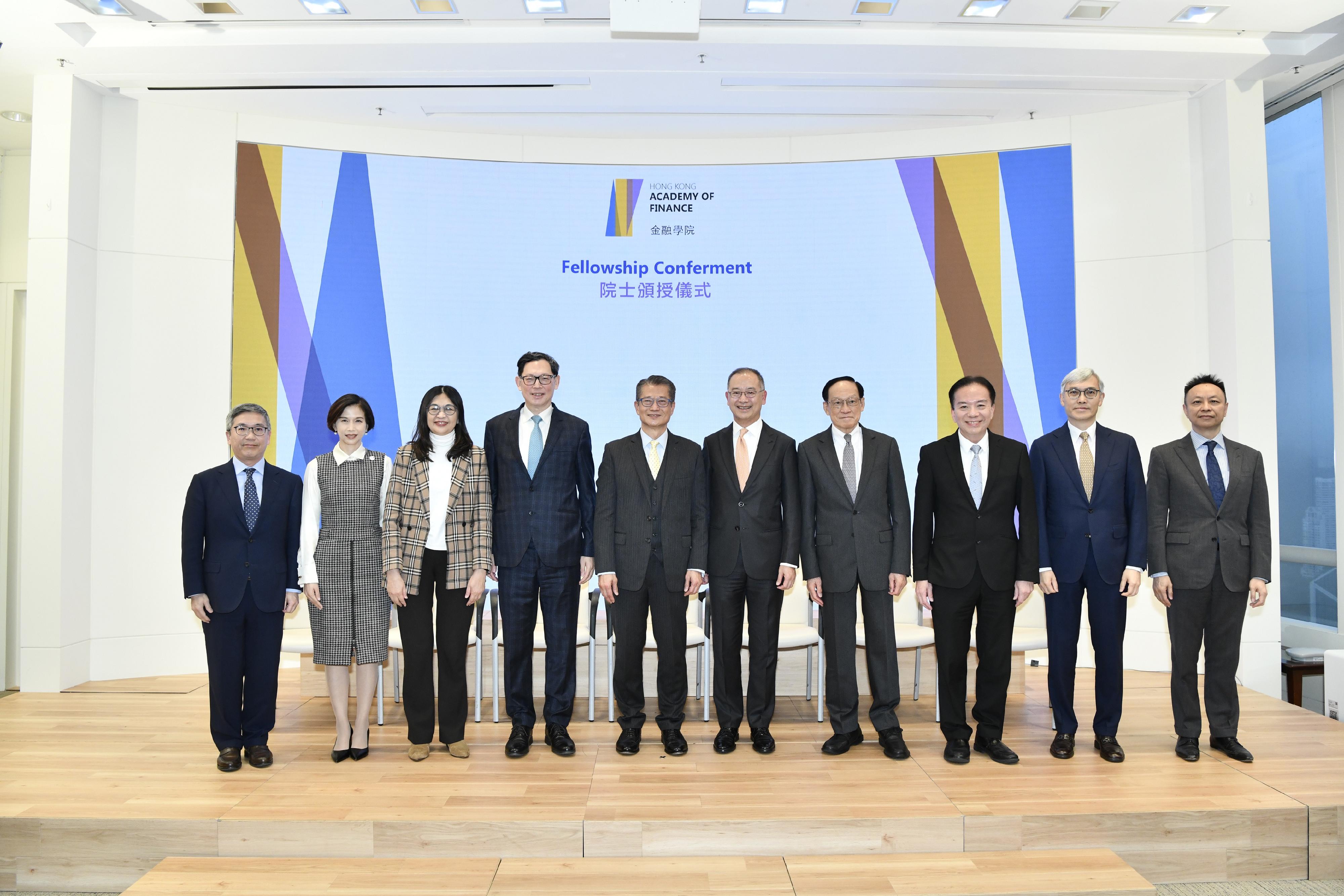 The Hong Kong Academy of Finance (AoF) confers Fellowship to three new Fellows today (December 14), including Dr Norman Chan (fourth left), Mr Edward Chen (fourth right) and Mr David Wong (third right). Photo shows the Financial Secretary and the Honorary President of the AoF, Mr Paul Chan (fifth left), the Chief Executive of the Hong Kong Monetary Authority and the Chairman of the AoF, Mr Eddie Yue (fifth right), and members of the Board of Directors of the AoF in a group photo with three new Fellows.