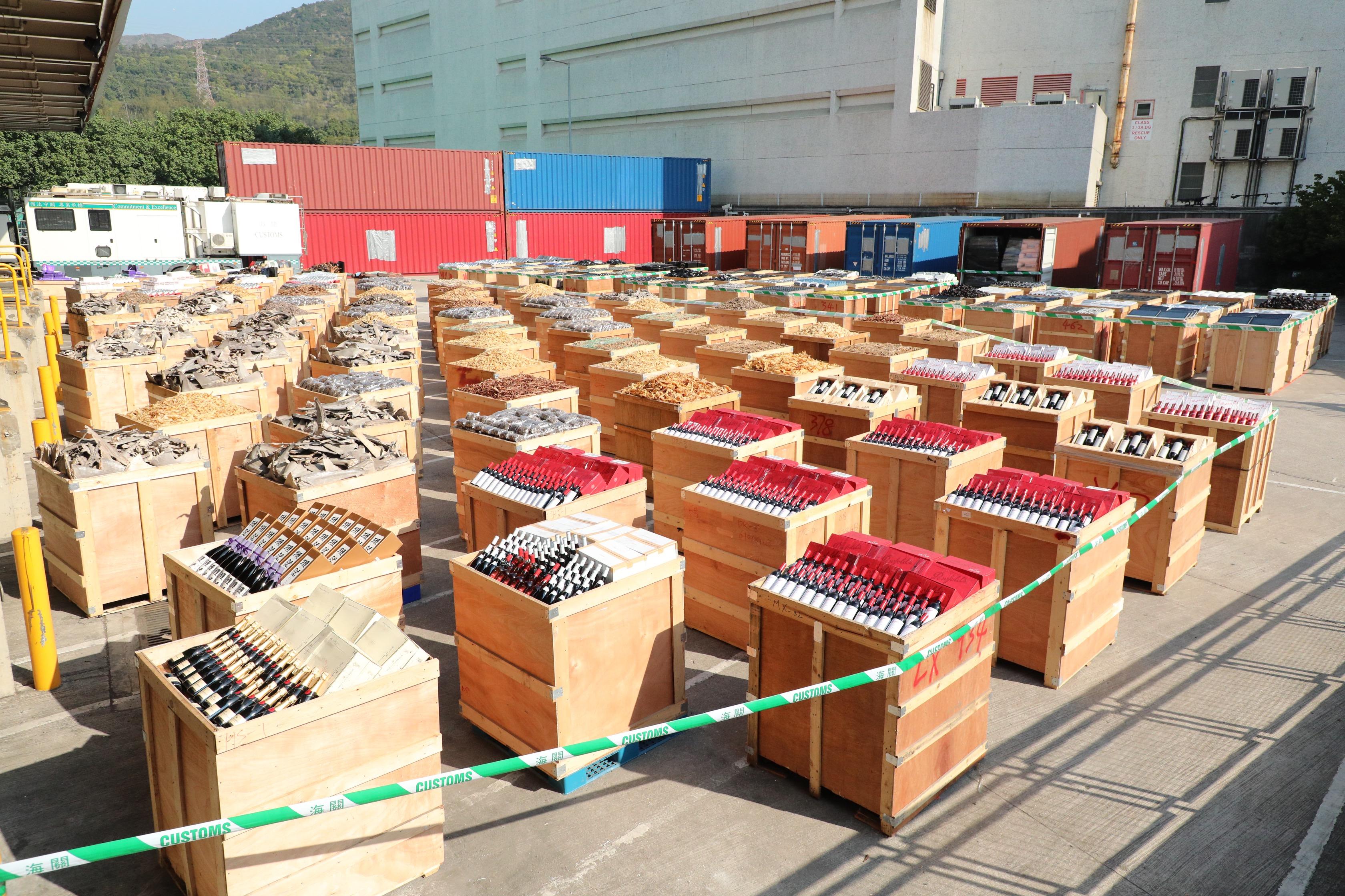 Hong Kong Customs on December 11 and 12 mounted a special enforcement operation codenamed "Convoy" and detected two suspected cases of using ocean-going vessels to smuggle goods to the Mainland at Tsing Yi Container Terminal. A large batch of suspected smuggled goods, including expensive food ingredients, electronic goods, vinyl records, table wines, medicine and scheduled endangered species, with a total estimated market value of about $200 million was seized. Photo shows some of the suspected smuggled goods seized.