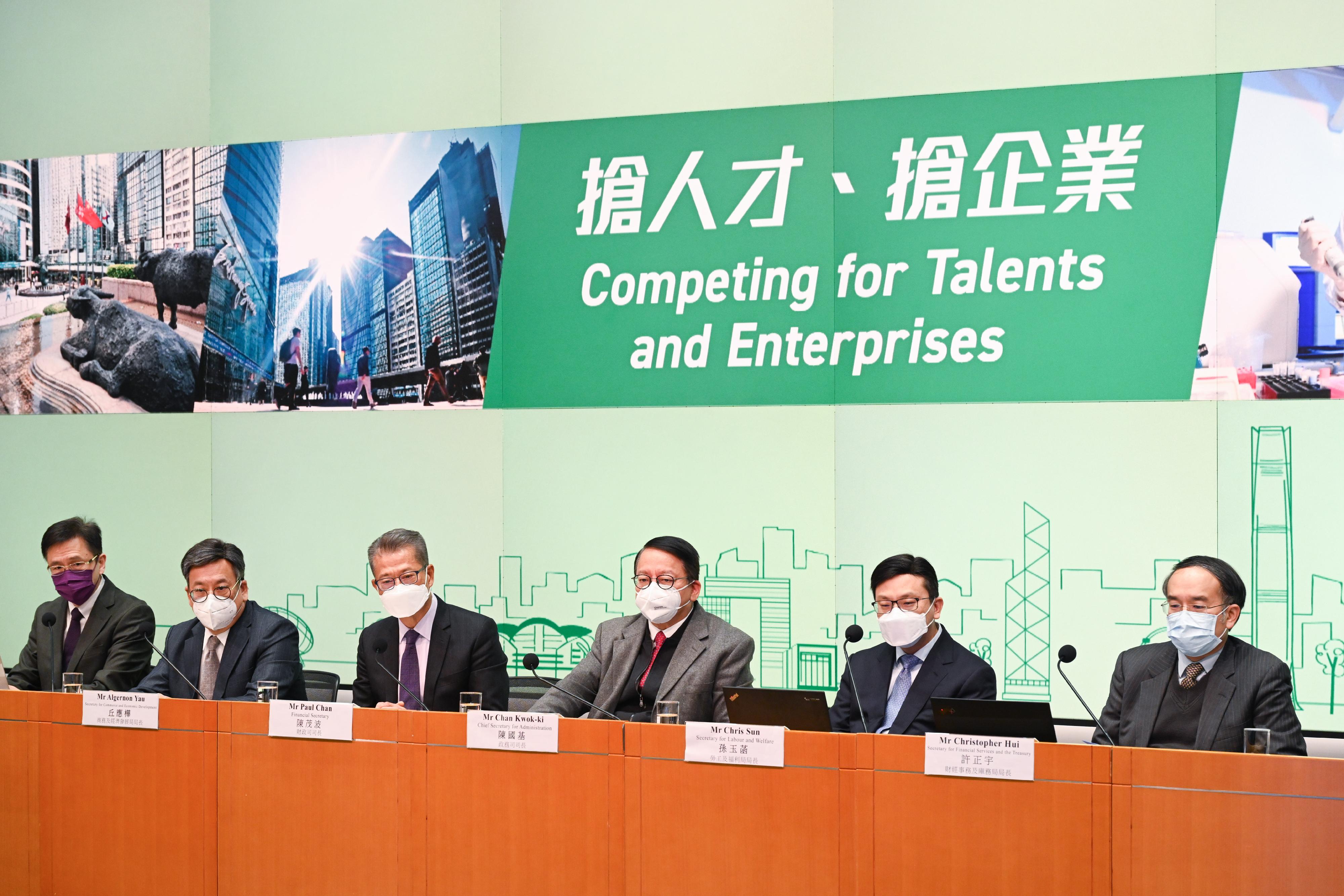 The Chief Secretary for Administration, Mr Chan Kwok-ki (third right), and the Financial Secretary, Mr Paul Chan (third left), hold a press conference on the implementation details of the Government's measures on "Competing for Talents and Enterprises" at the Central Government Offices, Tamar, today (December 23). The Secretary for Financial Services and the Treasury, Mr Christopher Hui (first right); the Secretary for Commerce and Economic Development, Mr Algernon Yau (second left); the Secretary for Innovation, Technology and Industry, Professor Sun Dong (first left); and the Secretary for Labour and Welfare, Mr Chris Sun (second right), also attended.