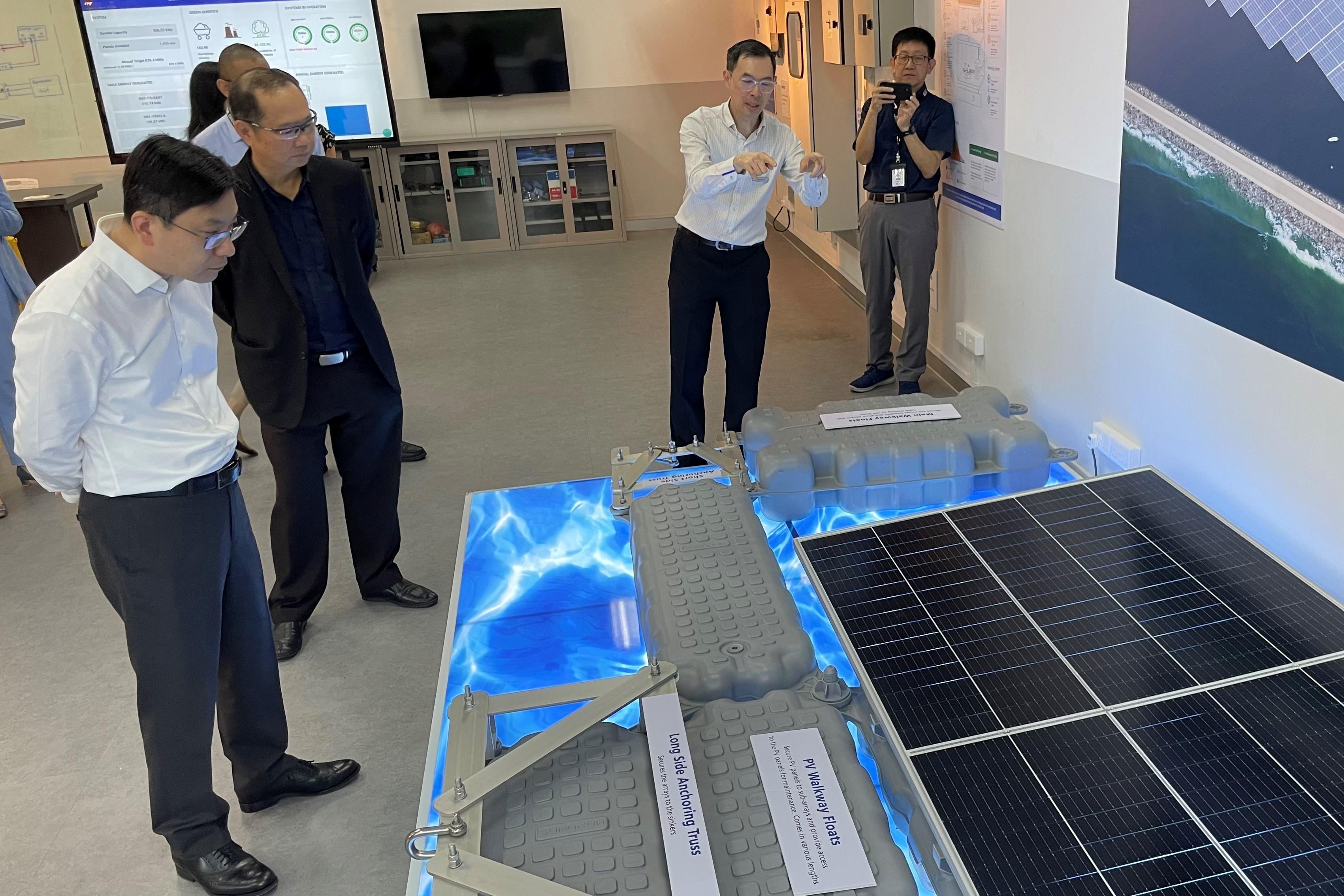 The Secretary for Labour and Welfare, Mr Chris Sun, visited the Institute of Technical Education yesterday afternoon (January 6) during his visit to Singapore to take a closer look at innovation and technology solutions for the sustainable development of human resources. Photo shows Mr Sun (first left) listening to an introduction on the operations of floating photovoltaic systems.