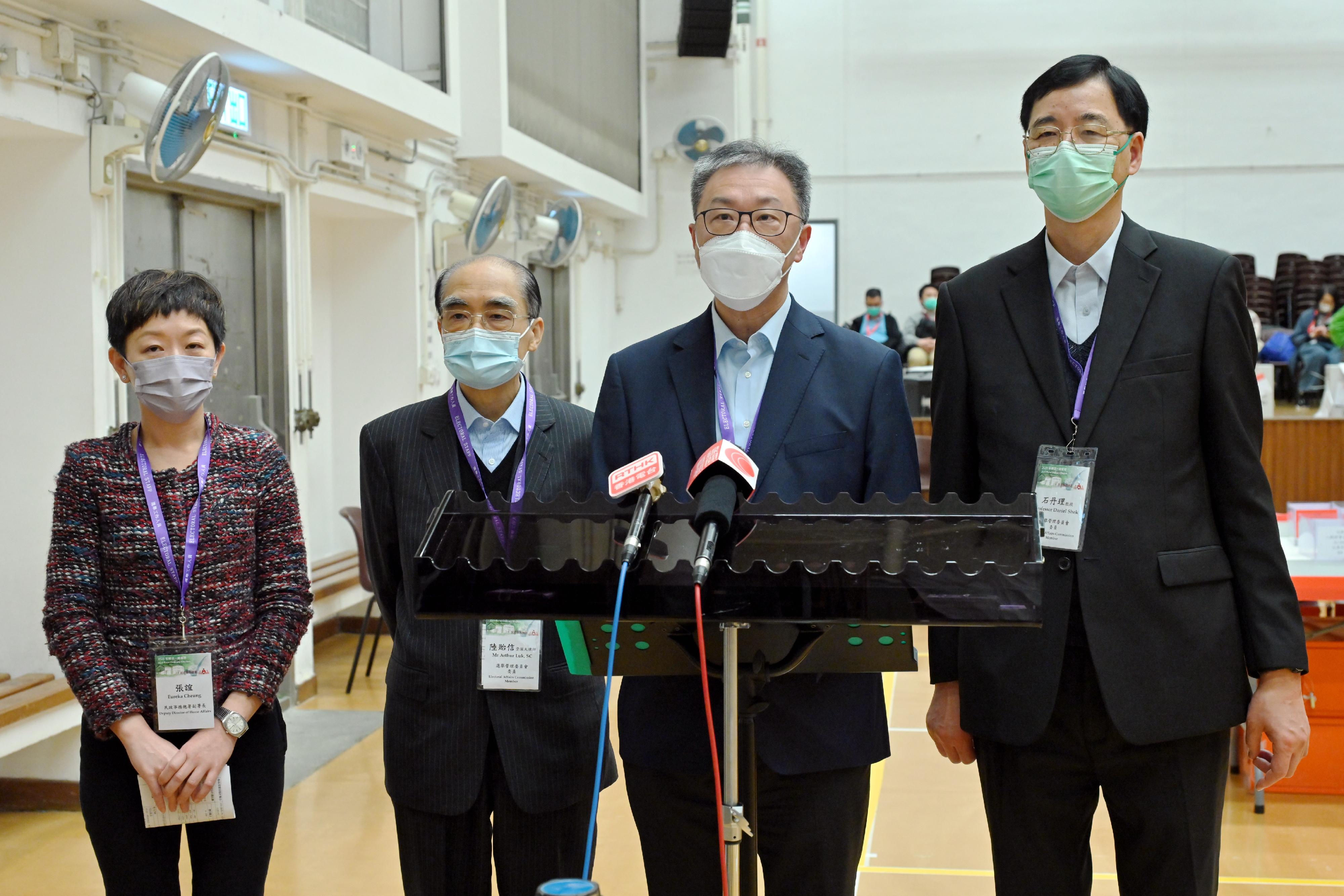 The Chairman of the Electoral Affairs Commission (EAC), Mr Justice David Lok (second right), EAC members Mr Arthur Luk, SC (second left), and Professor Daniel Shek (first right) met the media after visiting the ballot paper sorting station of the Village Representative Election in the 2023 Rural Ordinary Election at Hin Keng Neighbourhood Community Centre, Sha Tin today (January 8). Also present was Deputy Director of Home Affairs Ms Eureka Cheung (first left).