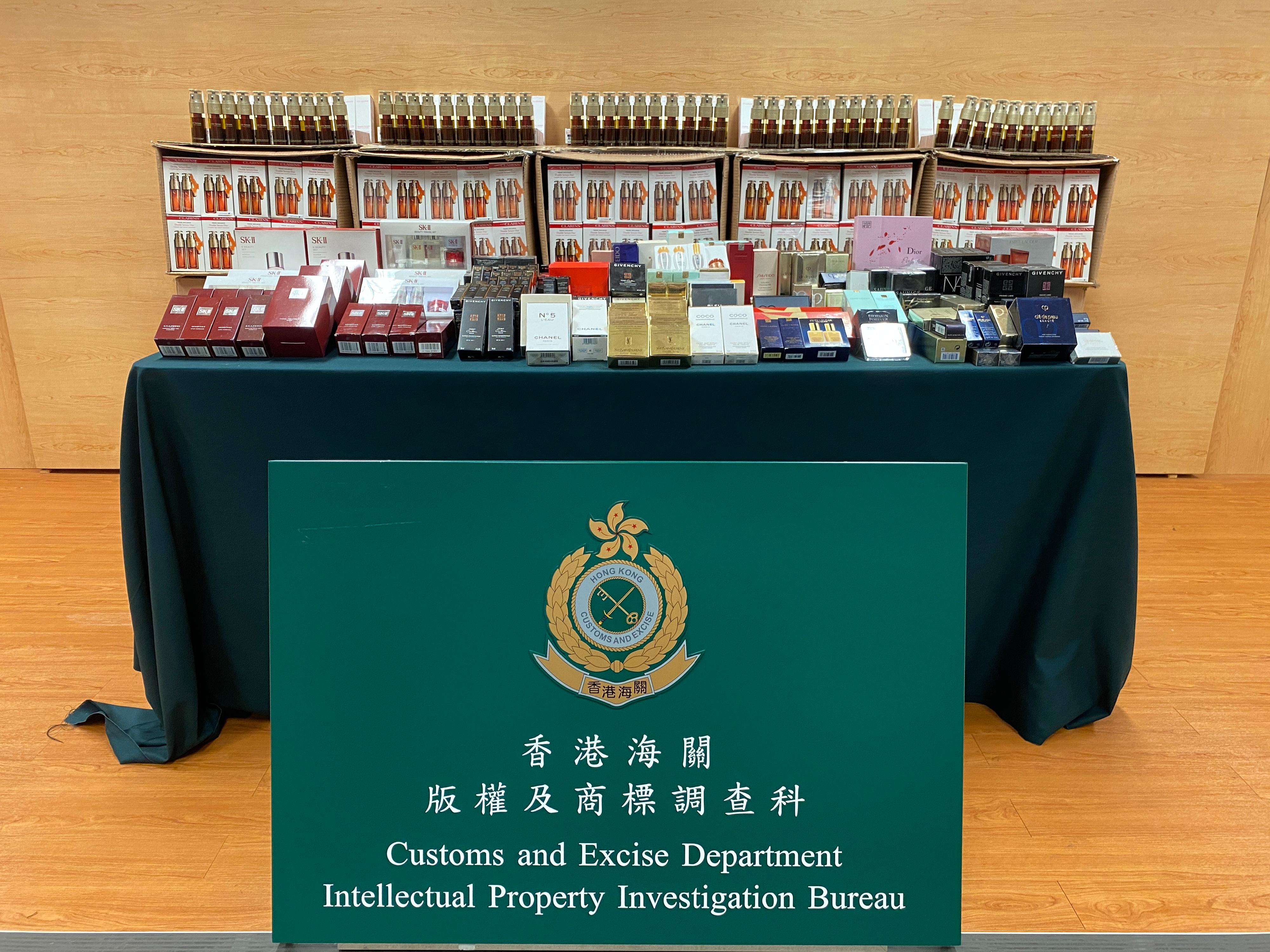 Hong Kong Customs yesterday (January 10) detected a case involving online sale of counterfeit cosmetics products and perfume and seized about 2 600 items of suspected counterfeit products with an estimated market value of about $960,000. Photo shows some of the suspected counterfeit products seized.