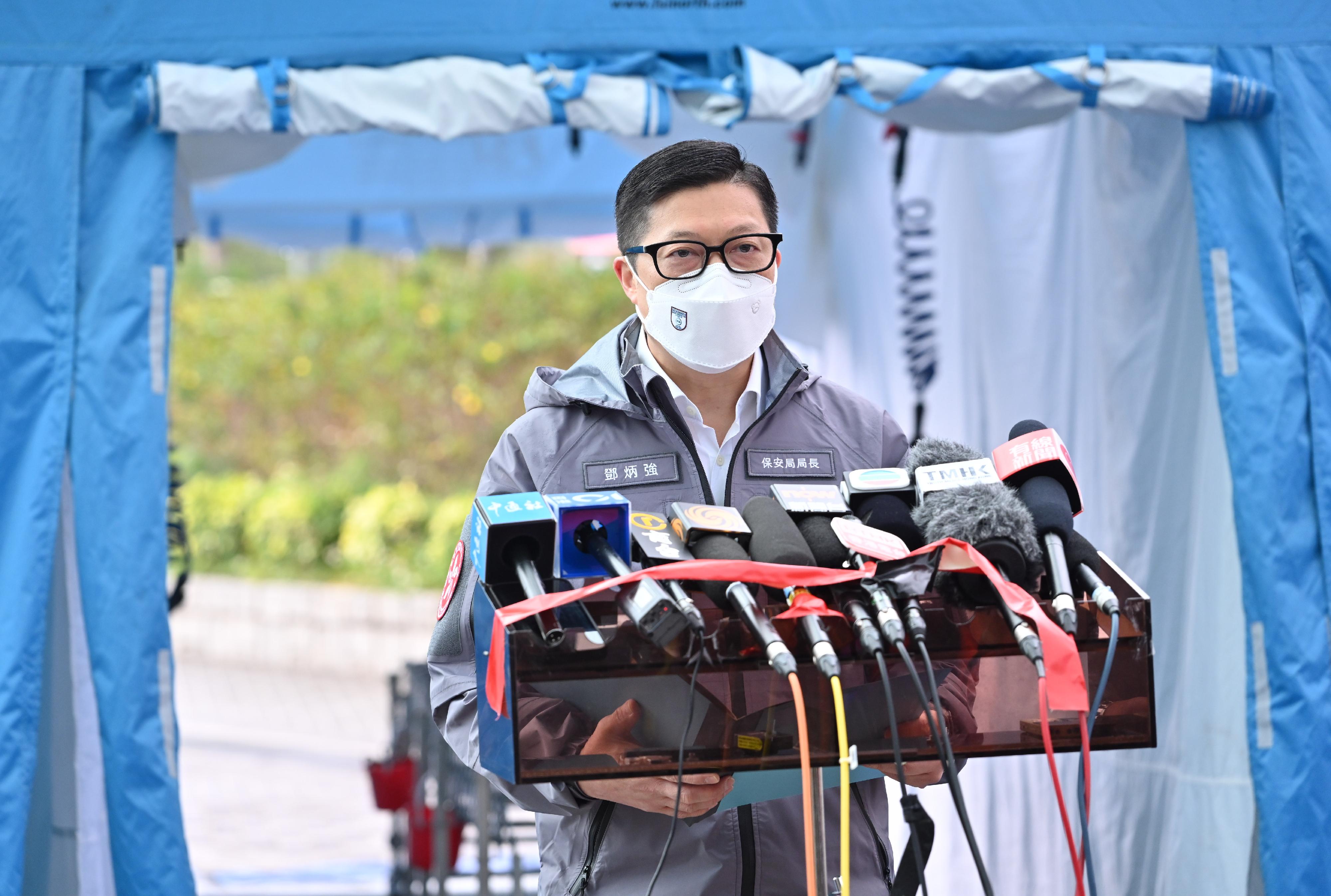 The Government conducted an inter-departmental exercise, "Checkerboard III", today (January 12). Photo shows the Secretary for Security, Mr Tang Ping-keung,  meeting the media at Ma Liu Shui Ferry Pier after observing the radiation checking and decontamination procedures for evacuees.