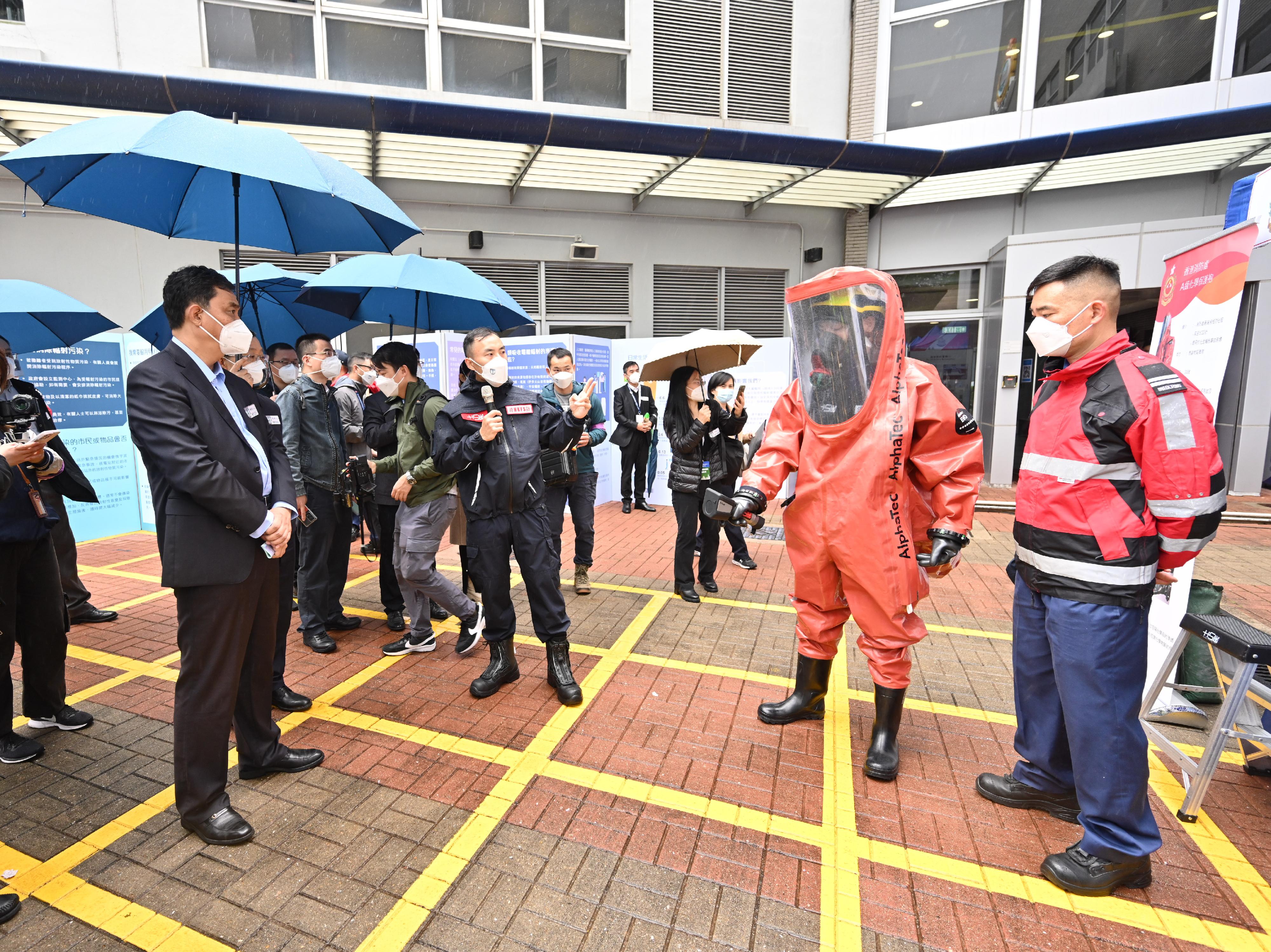 The Government conducted an inter-departmental exercise, "Checkerboard III", today (January 12). Photo shows experts viewing the Fire Services Department's HazMat (hazardous materials) Team exhibiting the Chemical Protection Suit (Level A) which provides the highest degree of protection and is designed for incidents involving toxic gas or unknown chemicals.