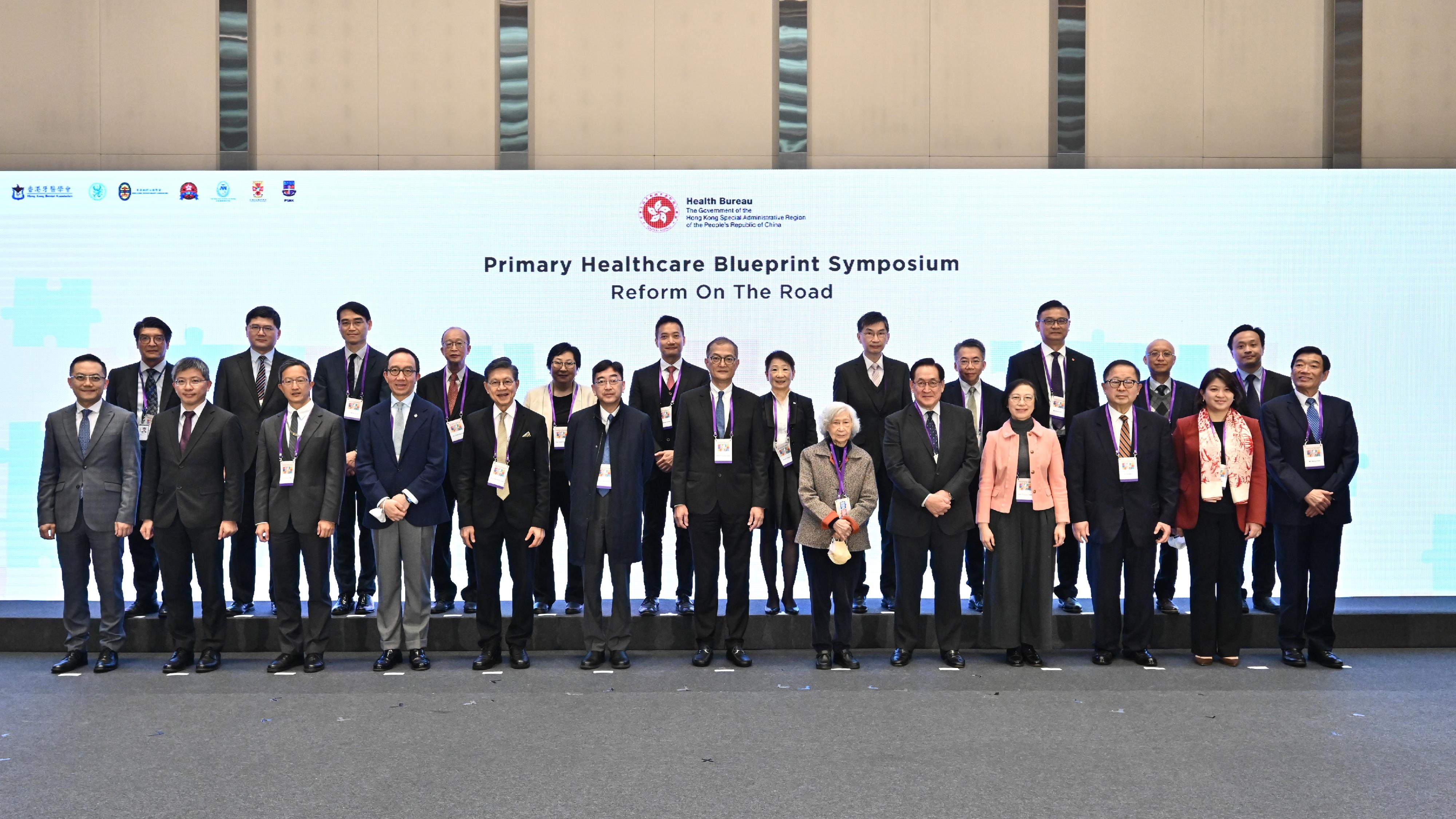 The Secretary for Health, Professor Lo Chung-mau (front row, centre), in a group photo with guests and speakers at the Primary Healthcare Blueprint Symposium today (January 15).