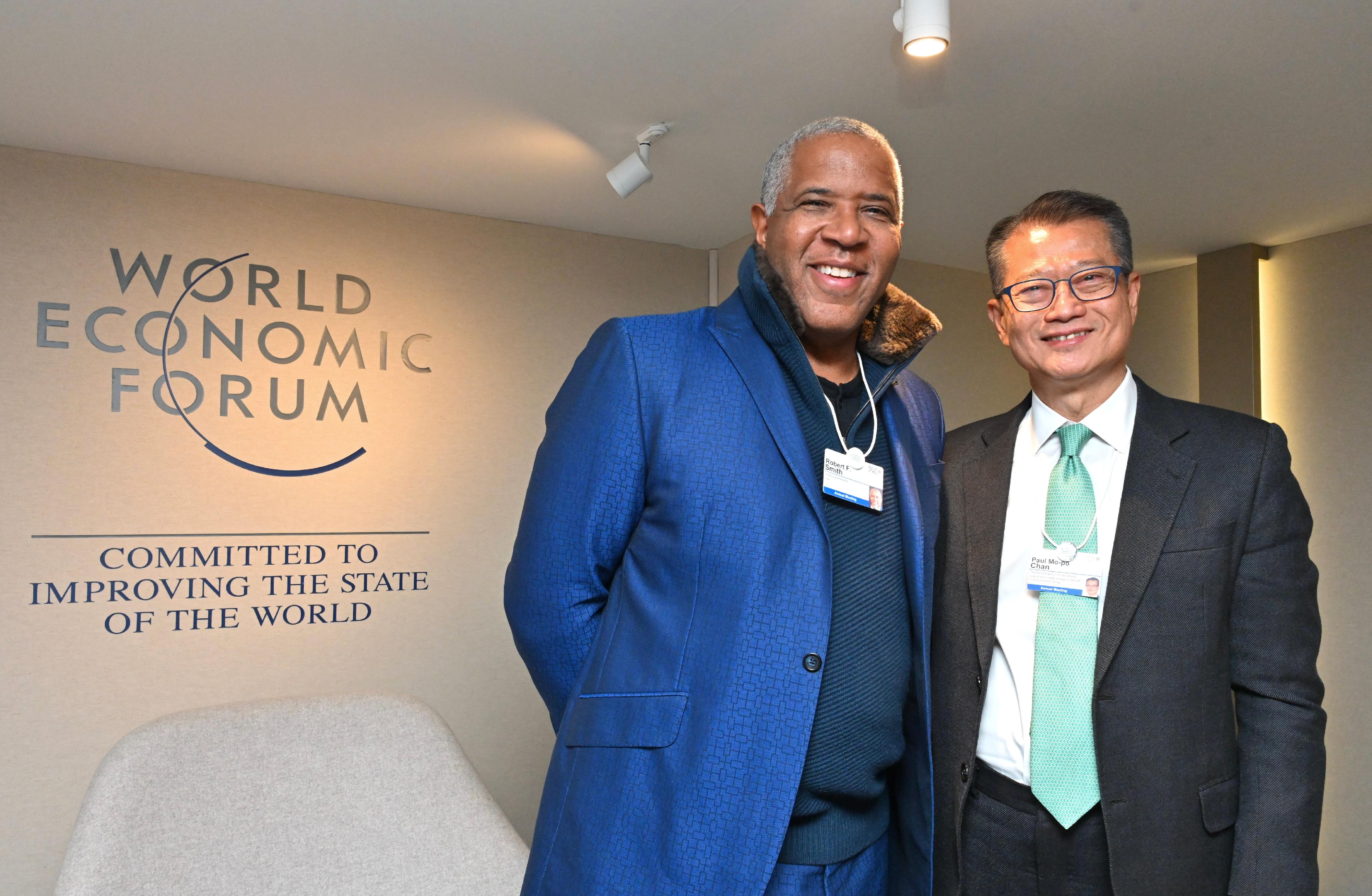 The Financial Secretary, Mr Paul Chan (right), met with Founder and Chairman of Vista Equity Partners, Mr Robert Smith, on January 16 at the World Economic Forum Annual Meeting 2023.