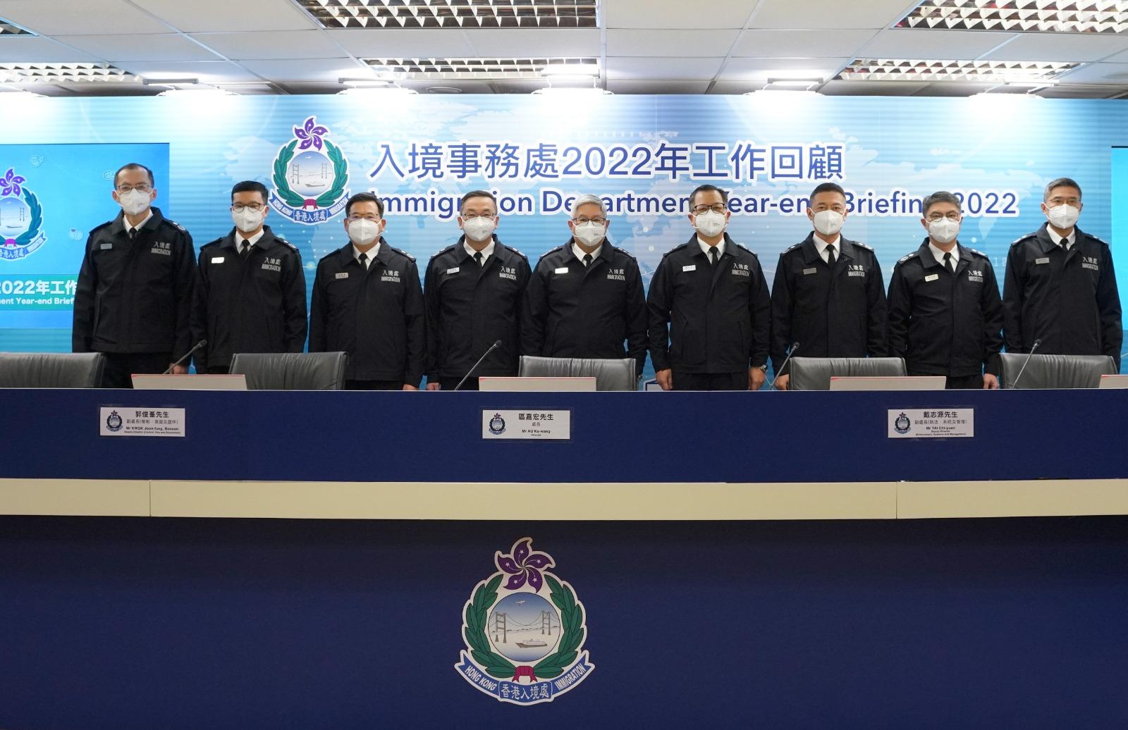 The Director of Immigration, Mr Au Ka-wang (fifth right), chairs the press conference of the Immigration Department's year-end review of 2022 today (January 17).