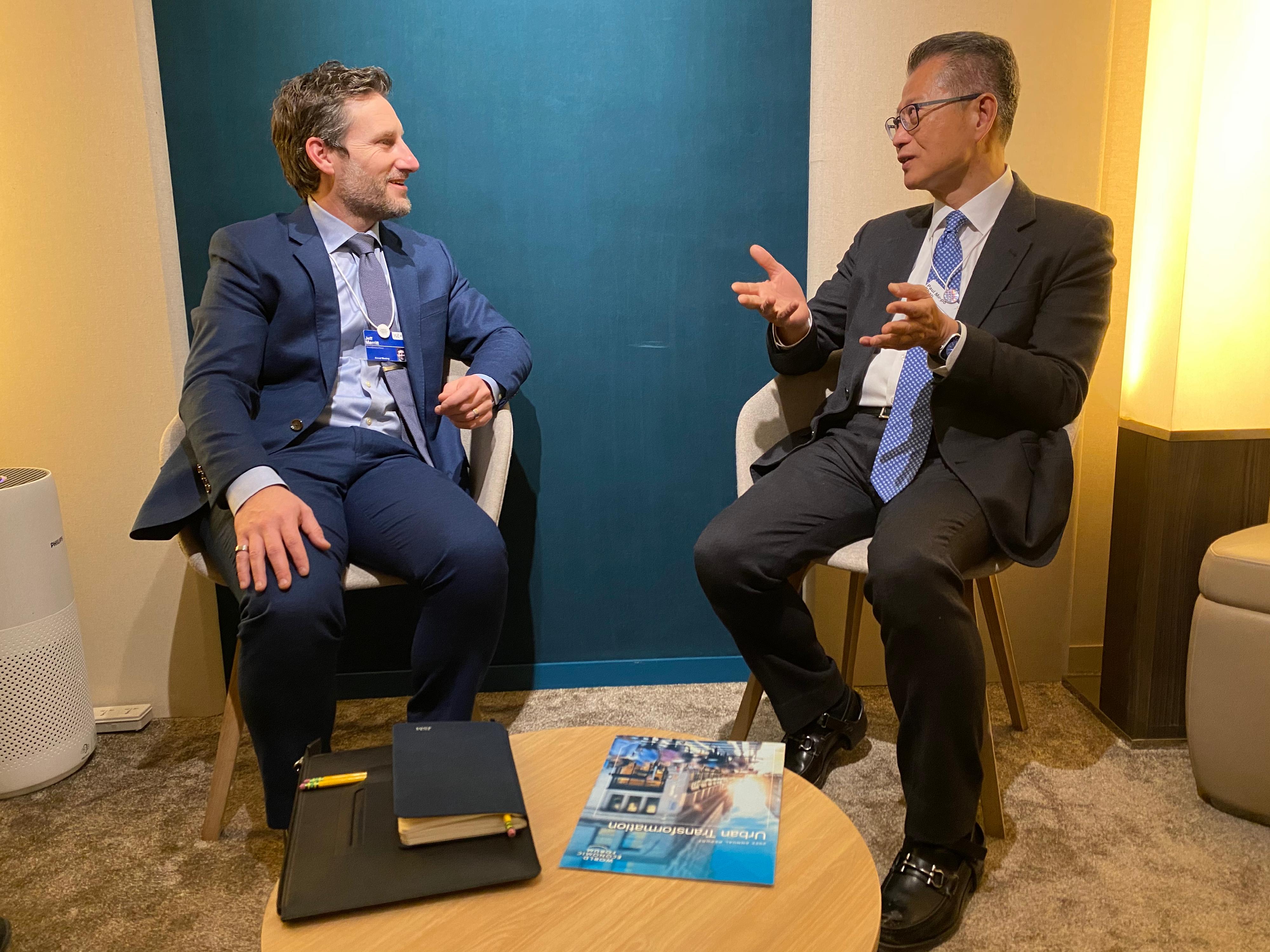 The Financial Secretary, Mr Paul Chan, made his third day of visit to Davos at the World Economic Forum Annual Meeting (January 18, Davos time). Photo shows the Financial Secretary, Mr Paul Chan (right), meeting with the member of the World Economic Forum Executive Committee and Head of Internet of Things and Urban Transformation Platform, Mr Jeff Merritt (left).