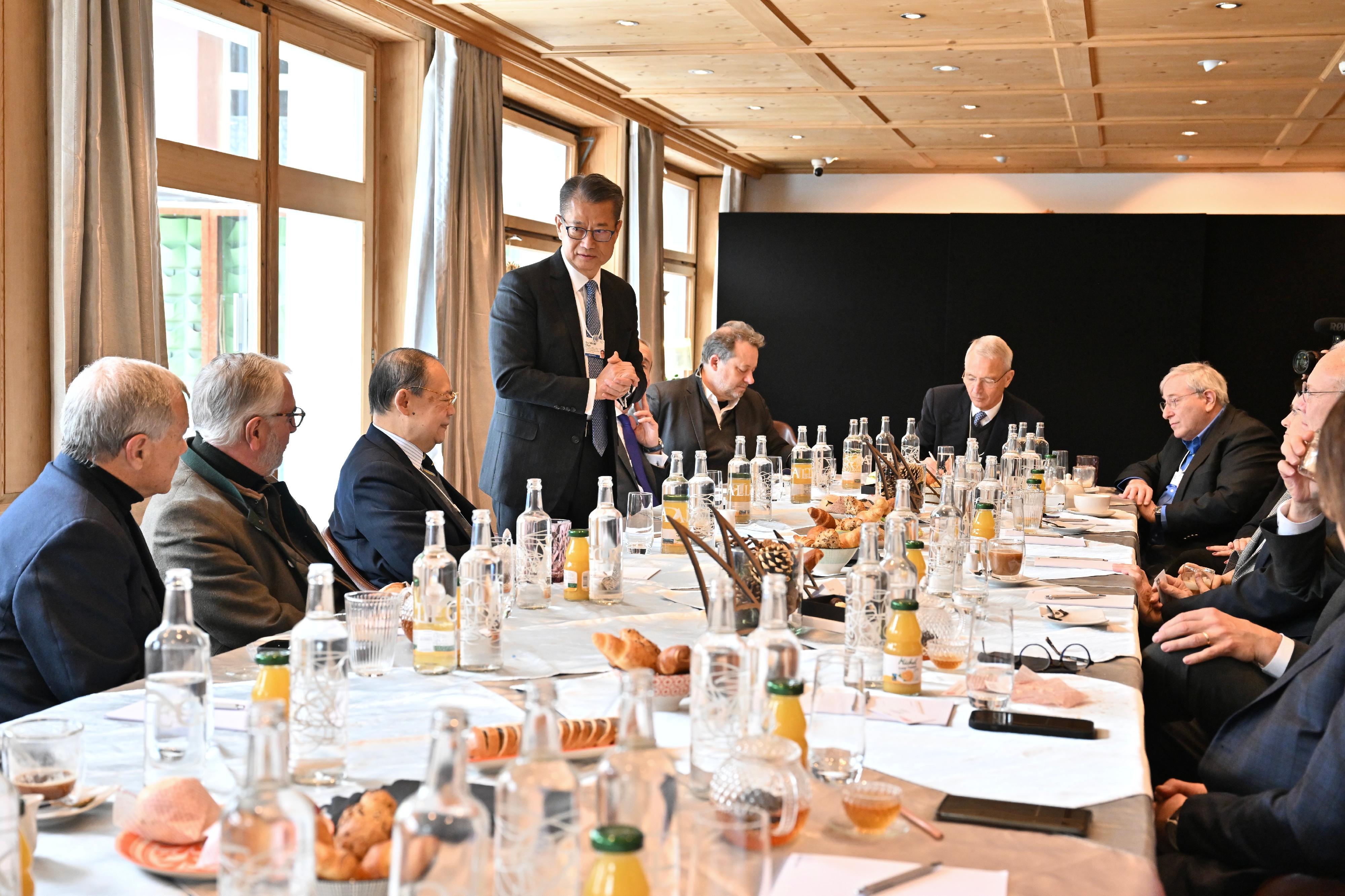 The Financial Secretary, Mr Paul Chan (fourth left), spoke at the gathering meeting co-hosted by the Co-chair of the Hong Kong-Europe Business Council, Mr Victor Chu, and the Chairman of Credit Suisse, Mr Axel Lehmann. Photo shows Mr Chan introducing Hong Kong's latest situation and opportunities of development to participants.
