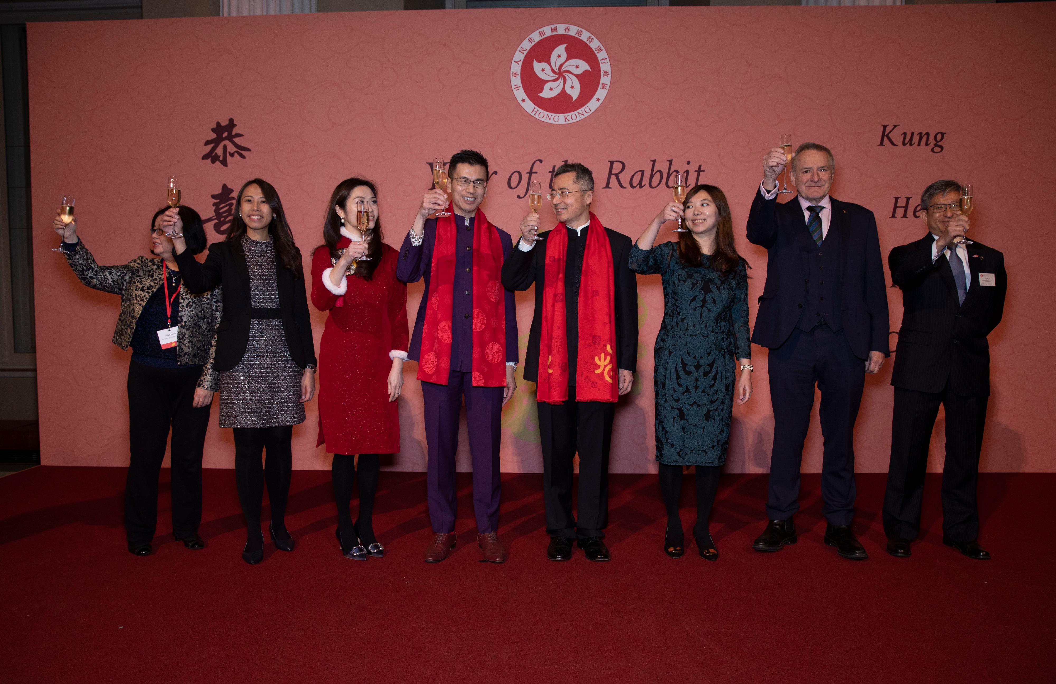 The Hong Kong Economic and Trade Office, London (London ETO) greeted the Year of the Rabbit in the United Kingdom by hosting a celebratory reception at Banqueting House, Whitehall, in London on January 26 (London time). Photo shows officiating guests, (from left)  the Conventions, Exhibitions and Corporate Events Department Manager of the Hong Kong Tourism Board in Europe, Ms Helen Chan; Deputy Director-General of the London ETO Ms Amy Wong; the Director of the UK, Nordics and Ireland of the Hong Kong Trade Development Council, Ms Daisy Ip; the Director-General of the London ETO, Mr Gilford Law; Minister Counsellor of the Embassy of the People's Republic of China in the United Kingdom of Great Britain and Northern Ireland Mr Wang Qi; Deputy Director-General of the London ETO Miss Josephine Tsang; Head of Business and Talent Attraction/Investment Promotion of the London ETO, Mr Andrew Davis; and the Marine Adviser of the Marine Department’s Regional Desk (London) /Regional Head (London) of the Hong Kong Shipping Registry, Mr Ben Lau, welcoming the Year of the Rabbit with a toast at the reception.