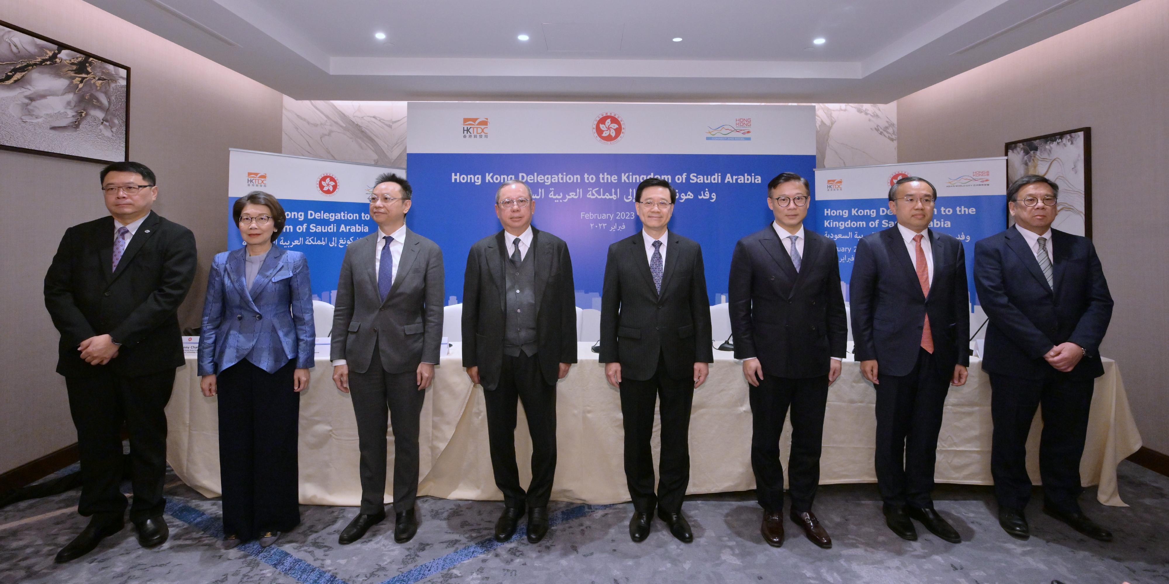 The Chief Executive, Mr John Lee (fourth right), together with the Deputy Secretary for Justice, Mr Cheung Kwok-kwan (third right); the Secretary for Financial Services and the Treasury, Mr Christopher Hui (second right); the Secretary for Commerce and Economic Development, Mr Algernon Yau (first right); the Chairman of the Hong Kong Trade Development Council, Dr Peter Lam (fourth left); Deputy Chief Executive of the Hong Kong Monetary Authority, Mr Darryl Chan (third left); the Chairman of the Hong Kong General Chamber of Commerce, Ms Betty Yuen (second left) and the Chairman of Hong Kong Science & Technology Parks Corporation, Dr Sunny Chai (first left) meets the media in Riyadh, Saudi Arabia, today (February 5, Riyadh time).