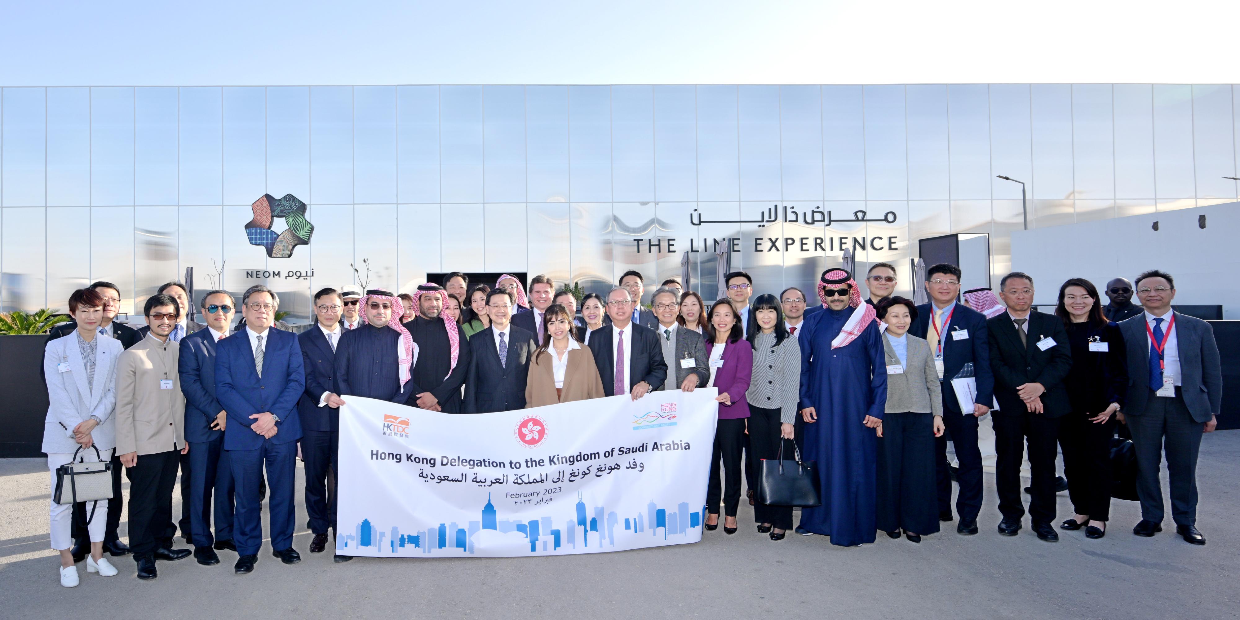 The Chief Executive, Mr John Lee, in Riyadh, Saudi Arabia, today (February 5, Riyadh time) tours "THE LINE Experience" exhibition to learn about the innovative urban designs of the futuristic city NEOM. Photo shows the Secretary for Financial Services and the Treasury, Mr Christopher Hui (third left, front row); the Secretary for Commerce and Economic Development, Mr Algernon Yau (fourth left, front row); the Deputy Secretary for Justice, Mr Cheung Kwok-kwan (fifth left, front row); Mr Lee(eighth left, front row); the Chairman of the Hong Kong Trade Development Council, Dr Peter Lam (tenth right, front row); the Chairman of Airport Authority Hong Kong, Mr Jack So(ninth right, front row); the Executive Director of the Hong Kong Trade Development Council, Miss Margaret Fong (seventh right, front row); the Hong Kong business delegation and representatives of the exhibition before touring the exhibition.