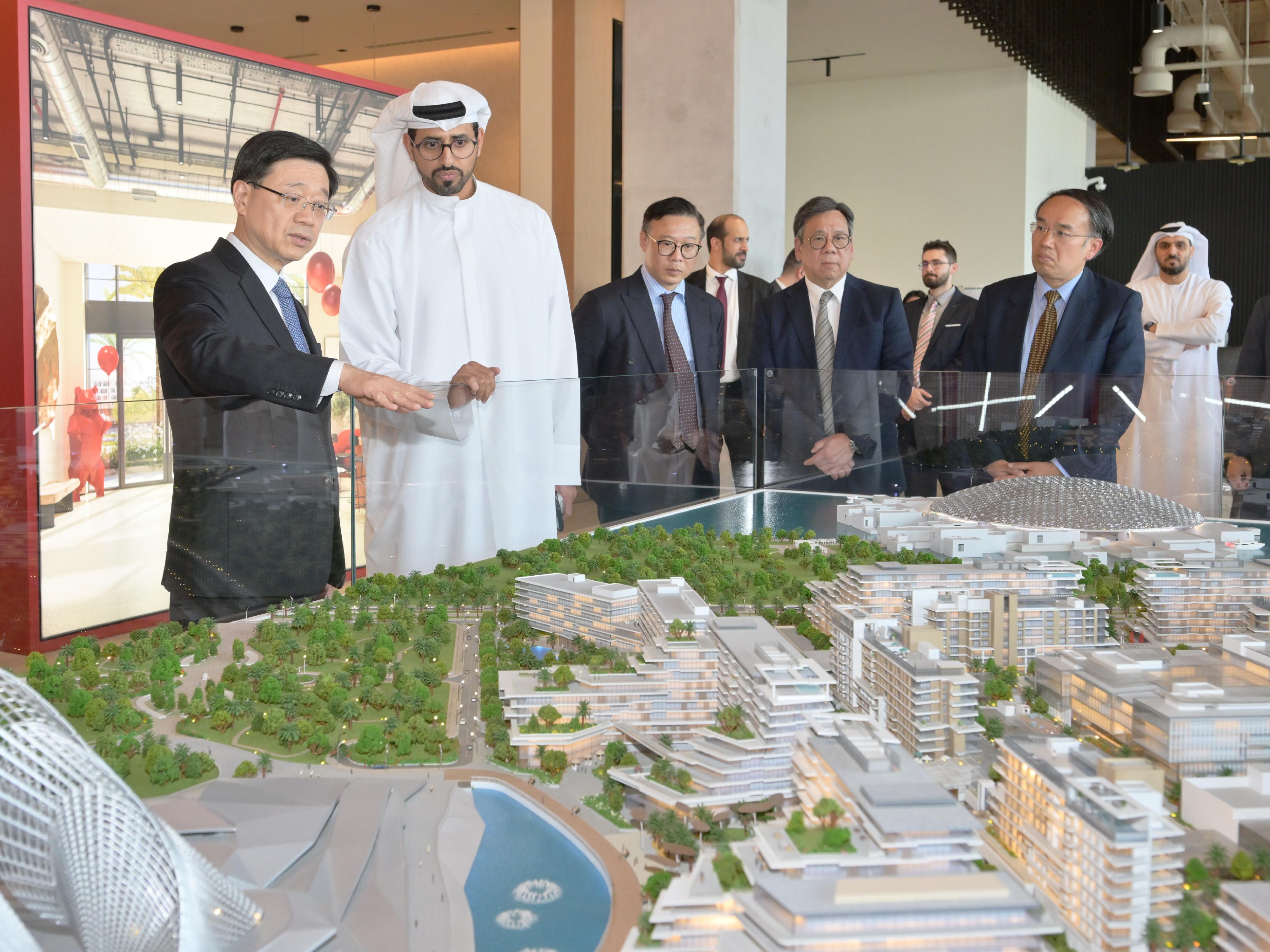 The Chief Executive, Mr John Lee, visited Aldar Properties PJSC in Abu Dhabi, the United Arab Emirates today (February 7, Abu Dhabi time). Photo shows Mr Lee (first left); the Deputy Secretary for Justice, Mr Cheung Kwok-kwan (third left); the Secretary for Financial Services and the Treasury, Mr Christopher Hui (first right); and the Secretary for Commerce and Economic Development, Mr Algernon Yau (second right), receiving a briefing by a representative of Aldar Properties PJSC.