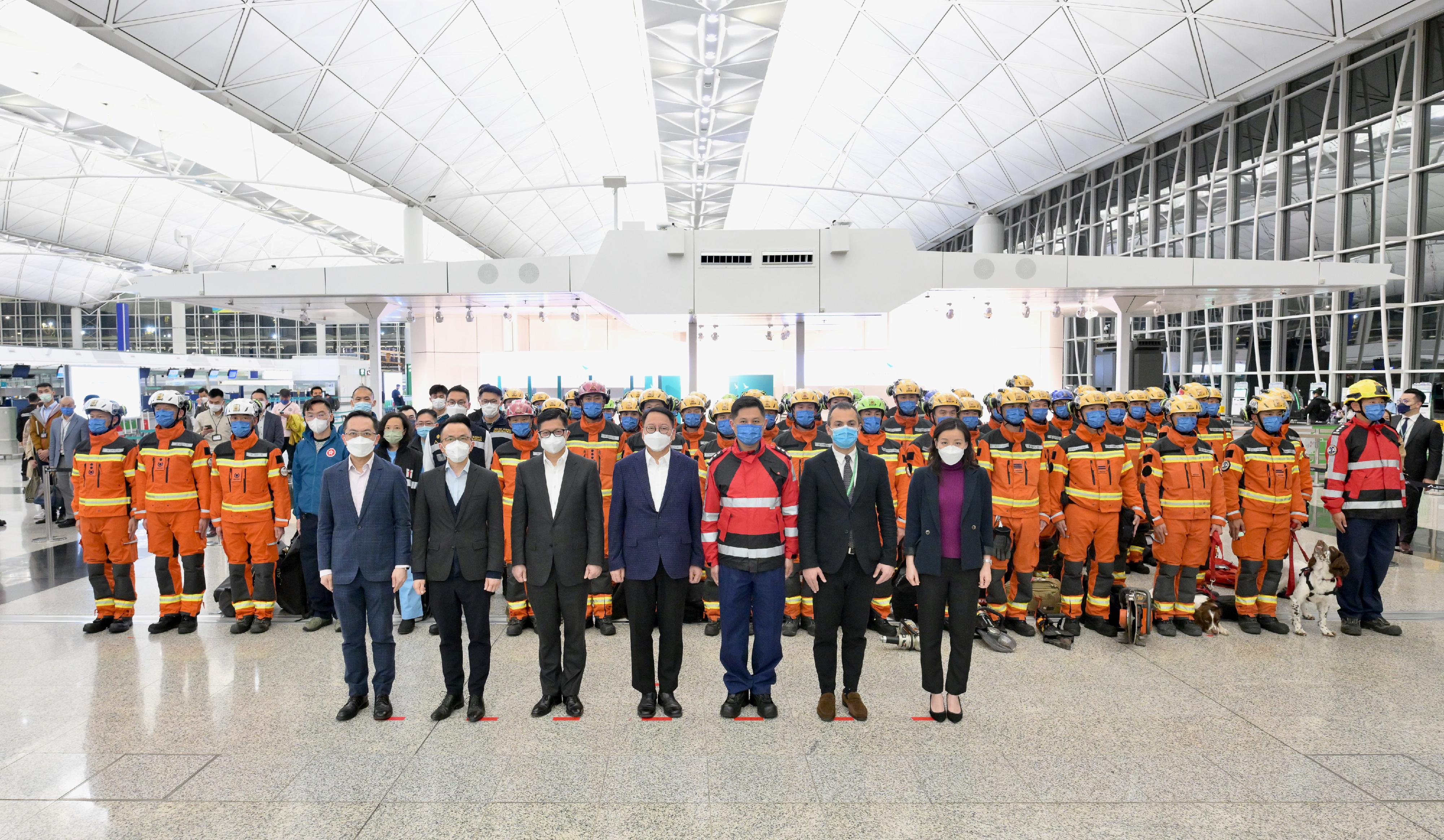 The Hong Kong Special Administrative Region (HKSAR) Government sent a 59-strong search and rescue team to the quake-stricken areas in Türkiye tonight (February 8) to assist in the search and rescue work. Photo shows (front row, from left) the Director of Health, Dr Ronald Lam; the Permanent Secretary for Security, Mr Patrick Li; the Secretary for Security, Mr Tang Ping-keung; the Acting Chief Executive, Mr Chan Kwok-ki; the Director of Fire Services, Mr Andy Yeung; the Consul General of Türkiye in Hong Kong, Mr Peyami Kalyoncu; and the HKSAR search and rescue team.